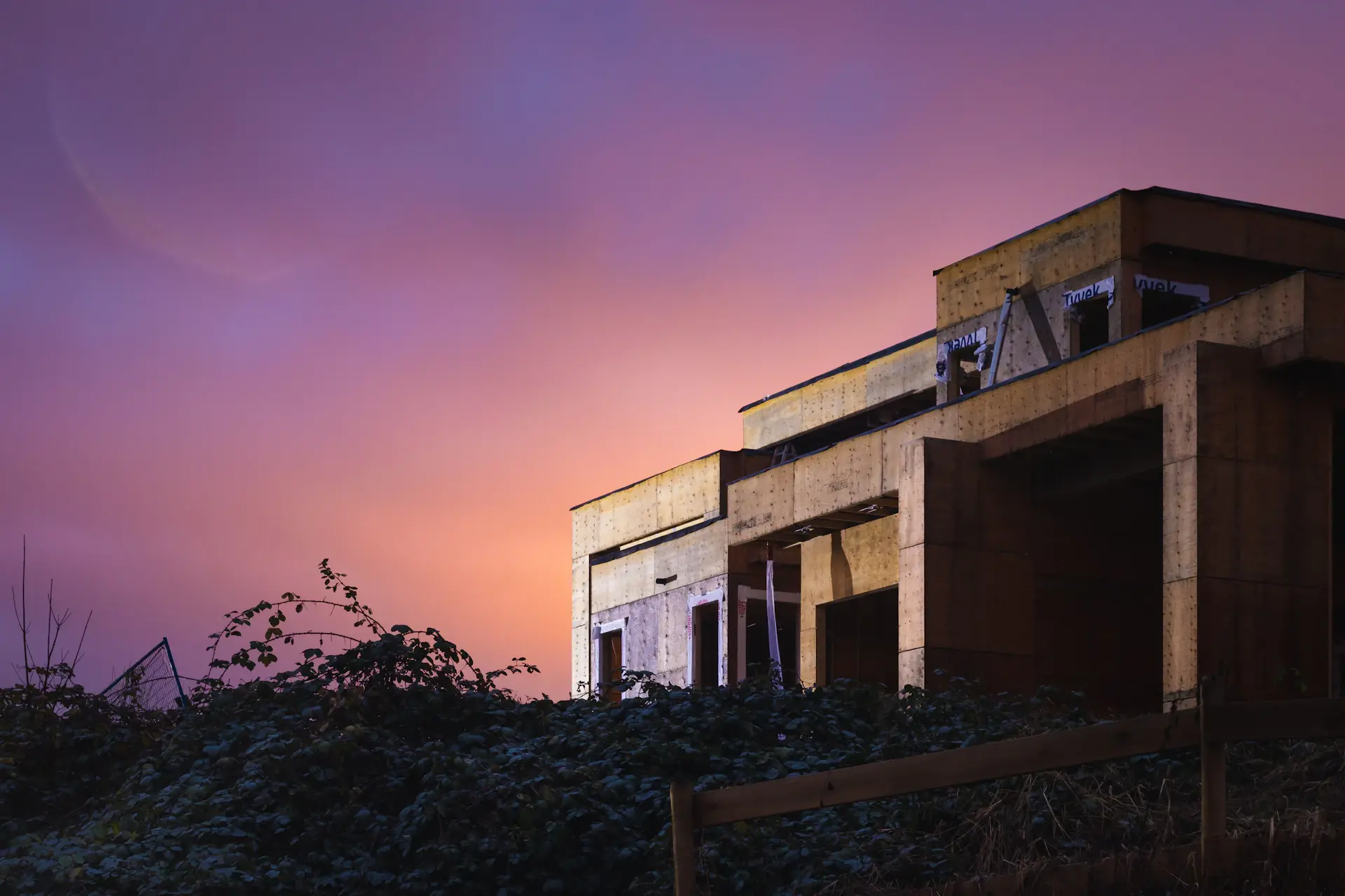 Architectural facade of a contemporary branded residence at dusk