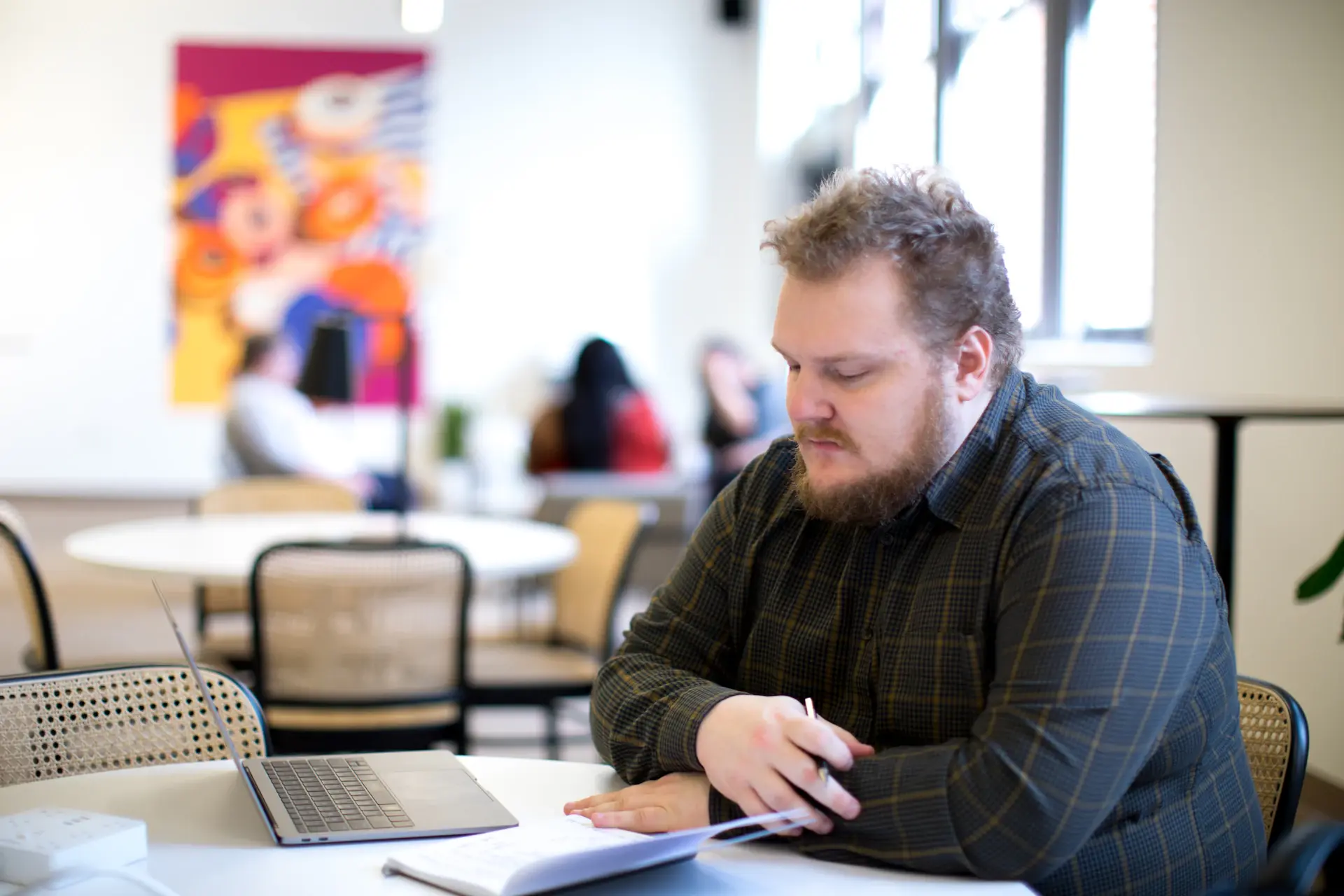 Private advisor reviewing a portfolio with a client in a modern office