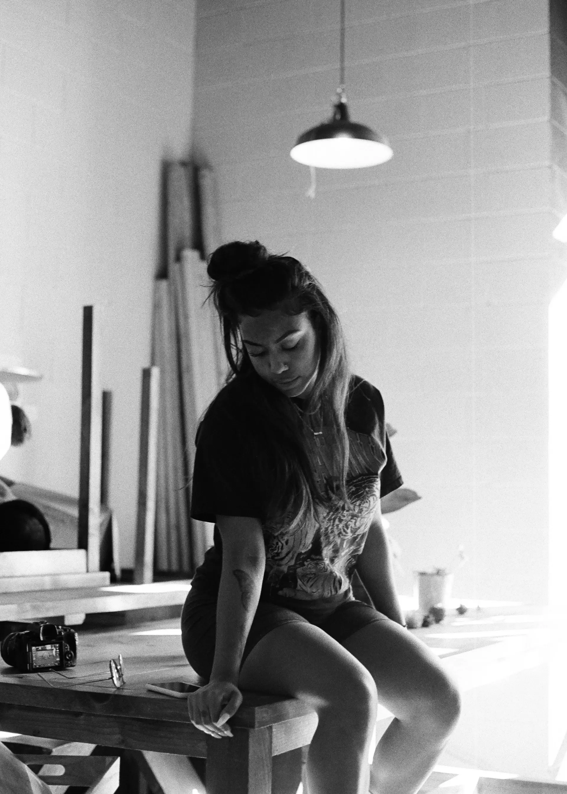 Portrait of a master leather artisan at her workbench
