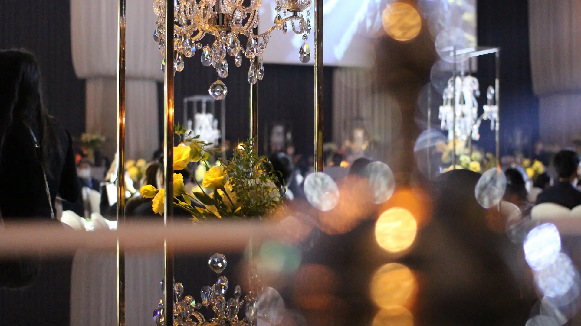 The Crystal Hall with glass walls and warm candlelight