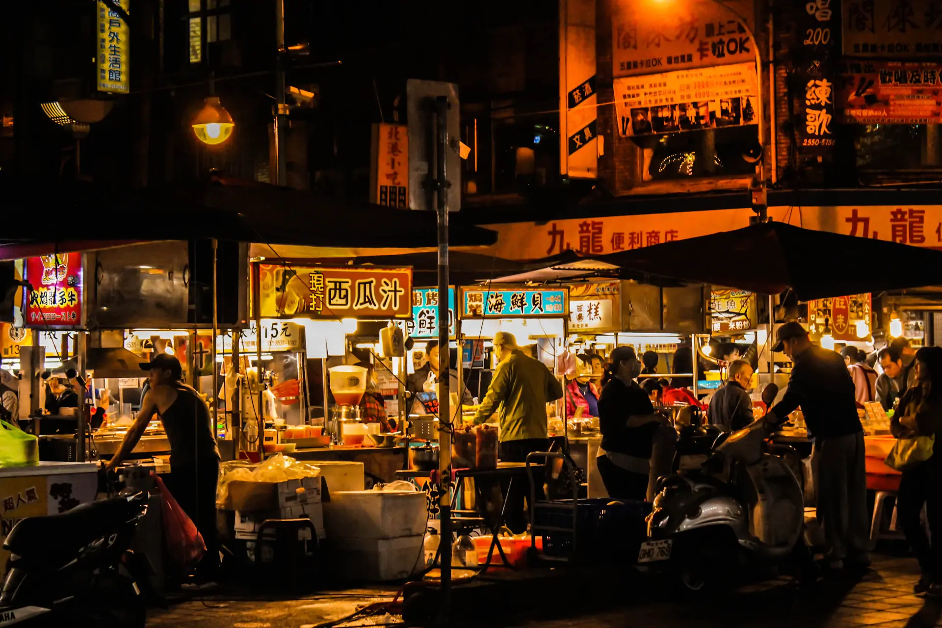 Students sharing a meal at a vibrant night market