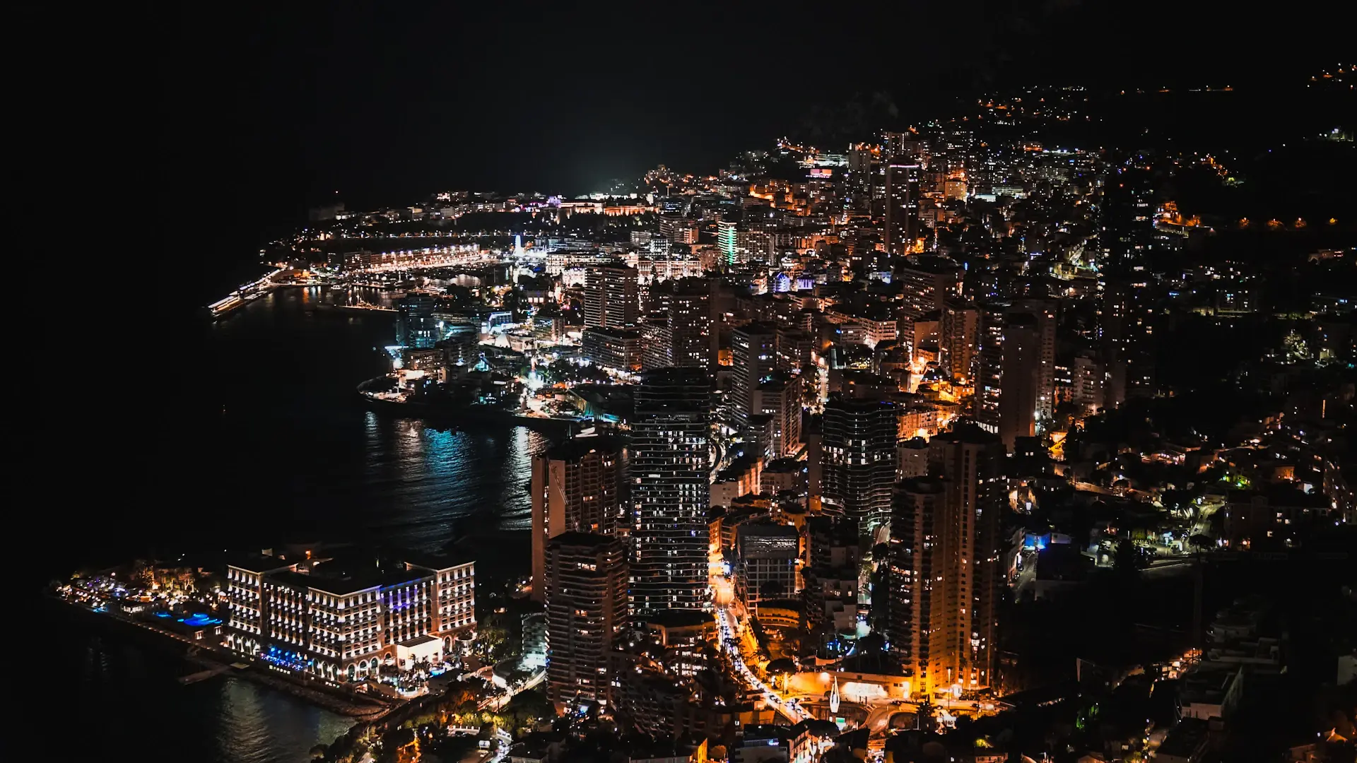 A motorcar on illuminated night streets of Monaco
