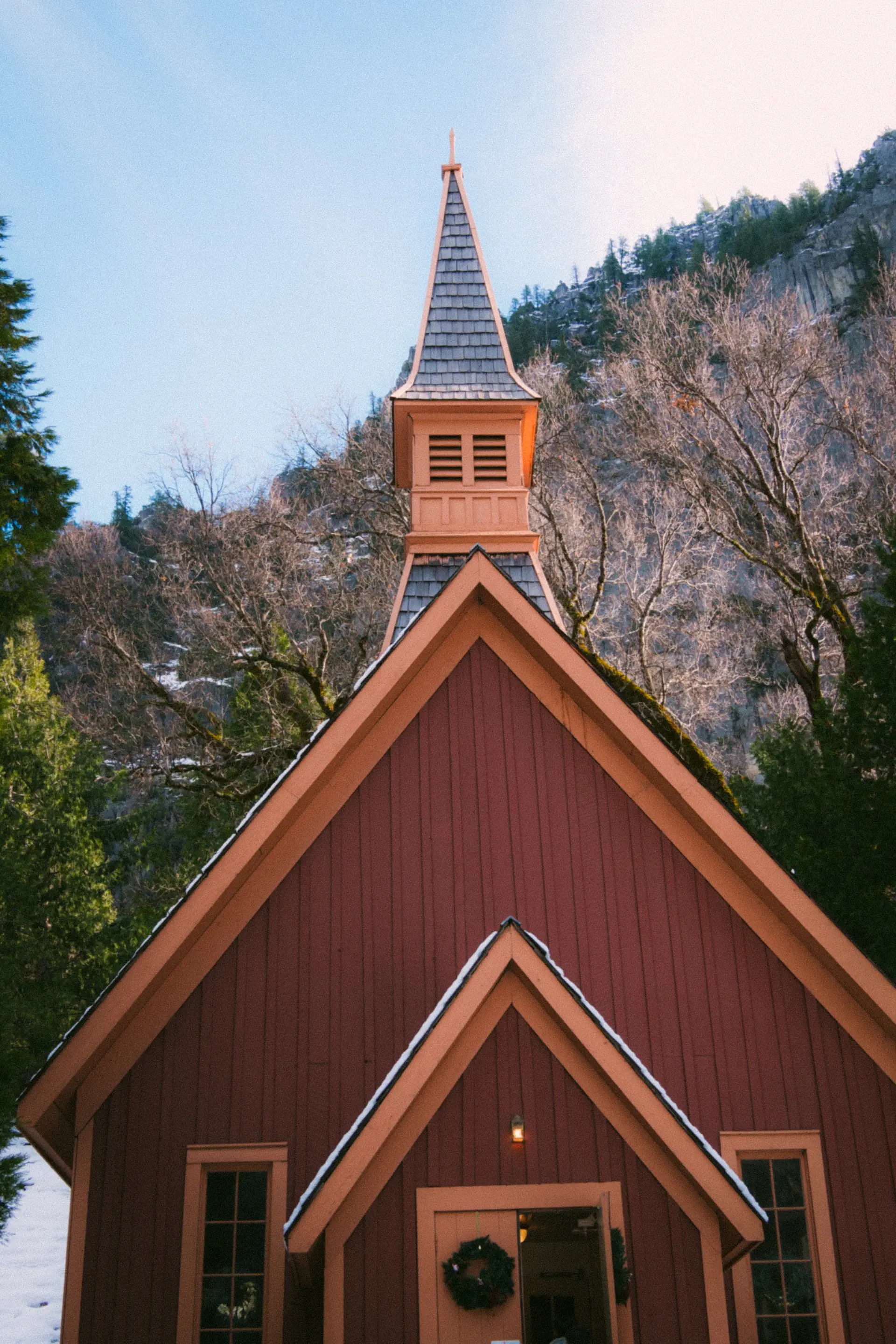 An intimate winter ceremony in a softly lit chapel