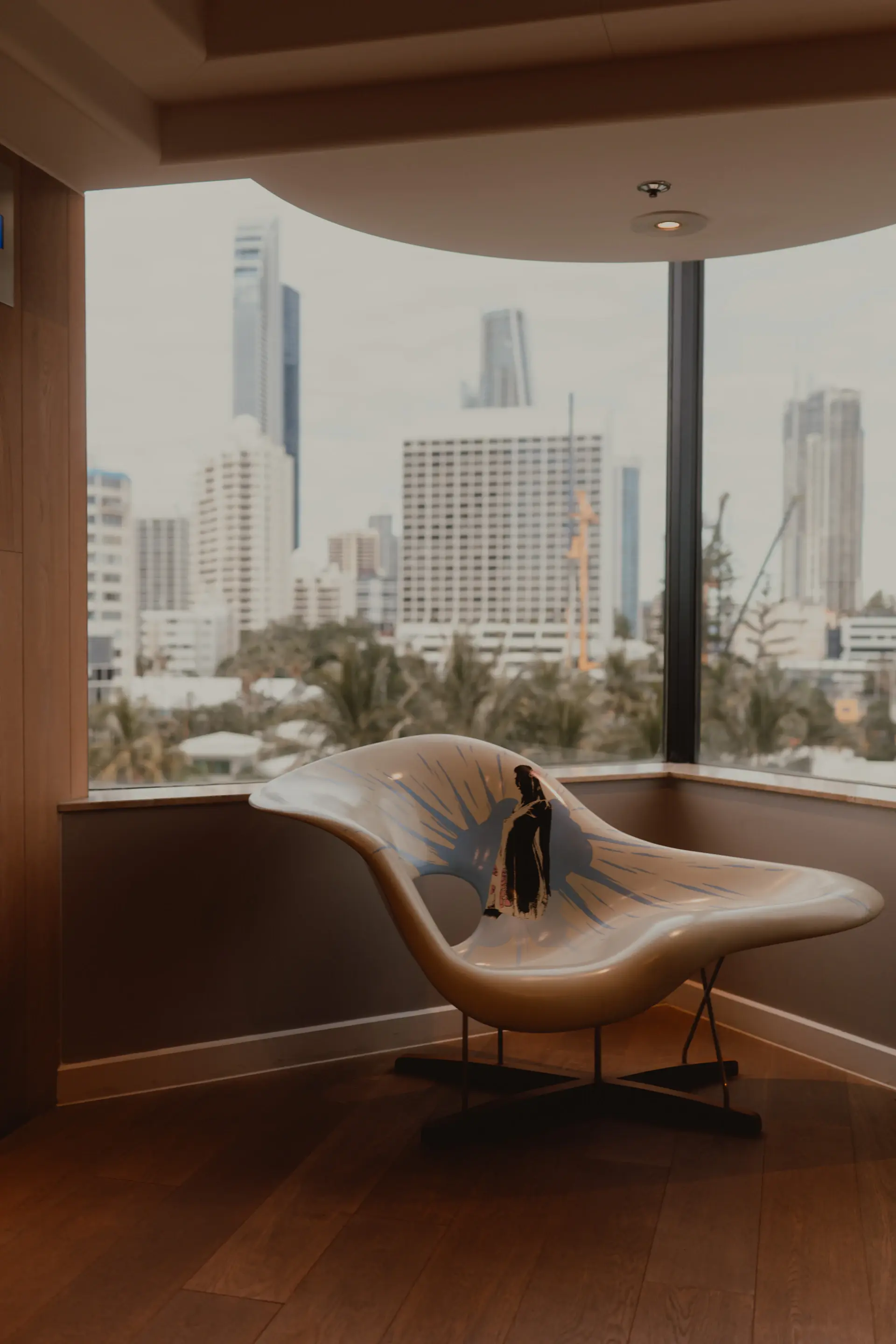 Luxury penthouse interior with floor-to-ceiling skyline windows