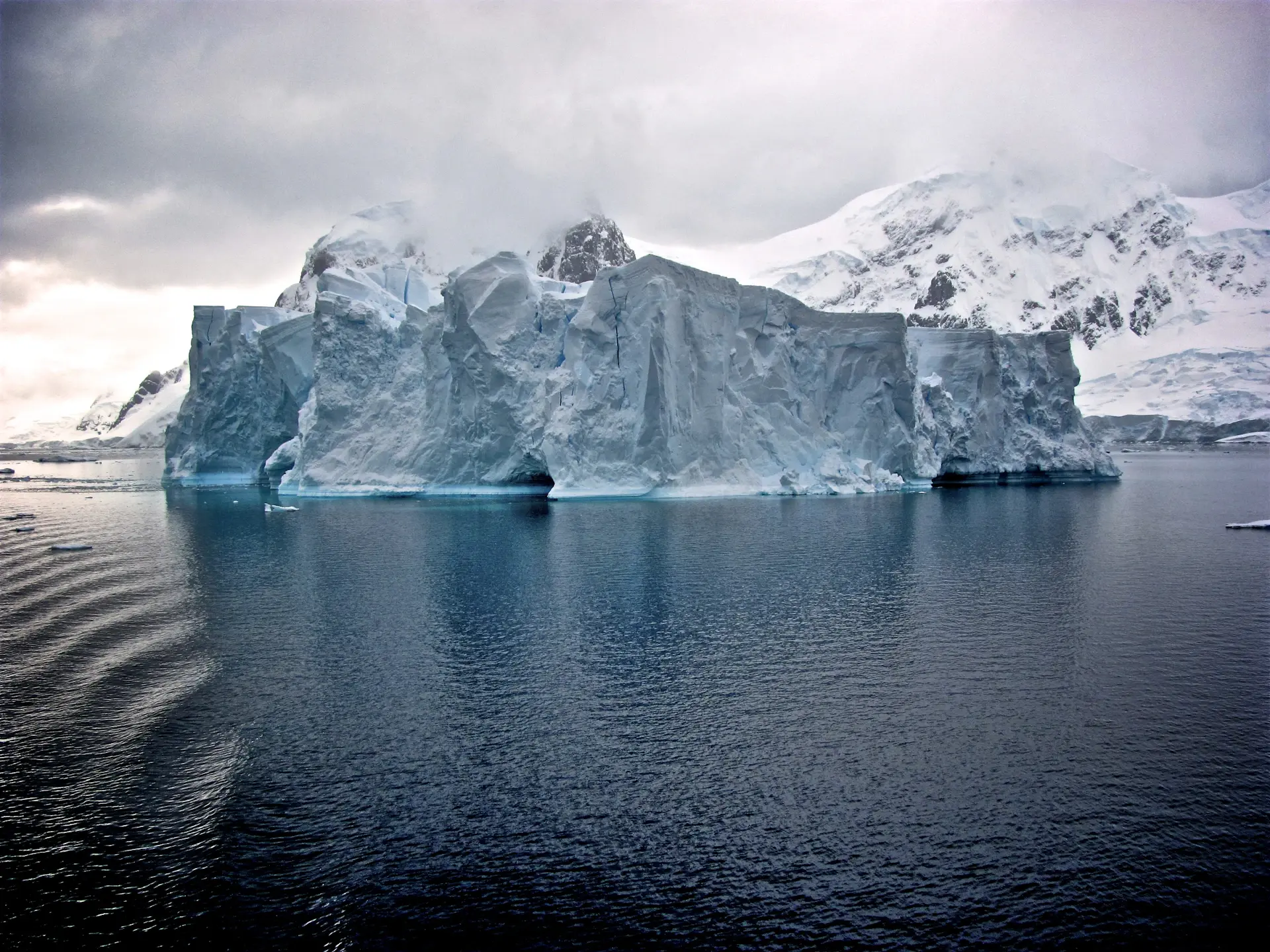 Vast Antarctic ice shelf glowing under a low polar sun