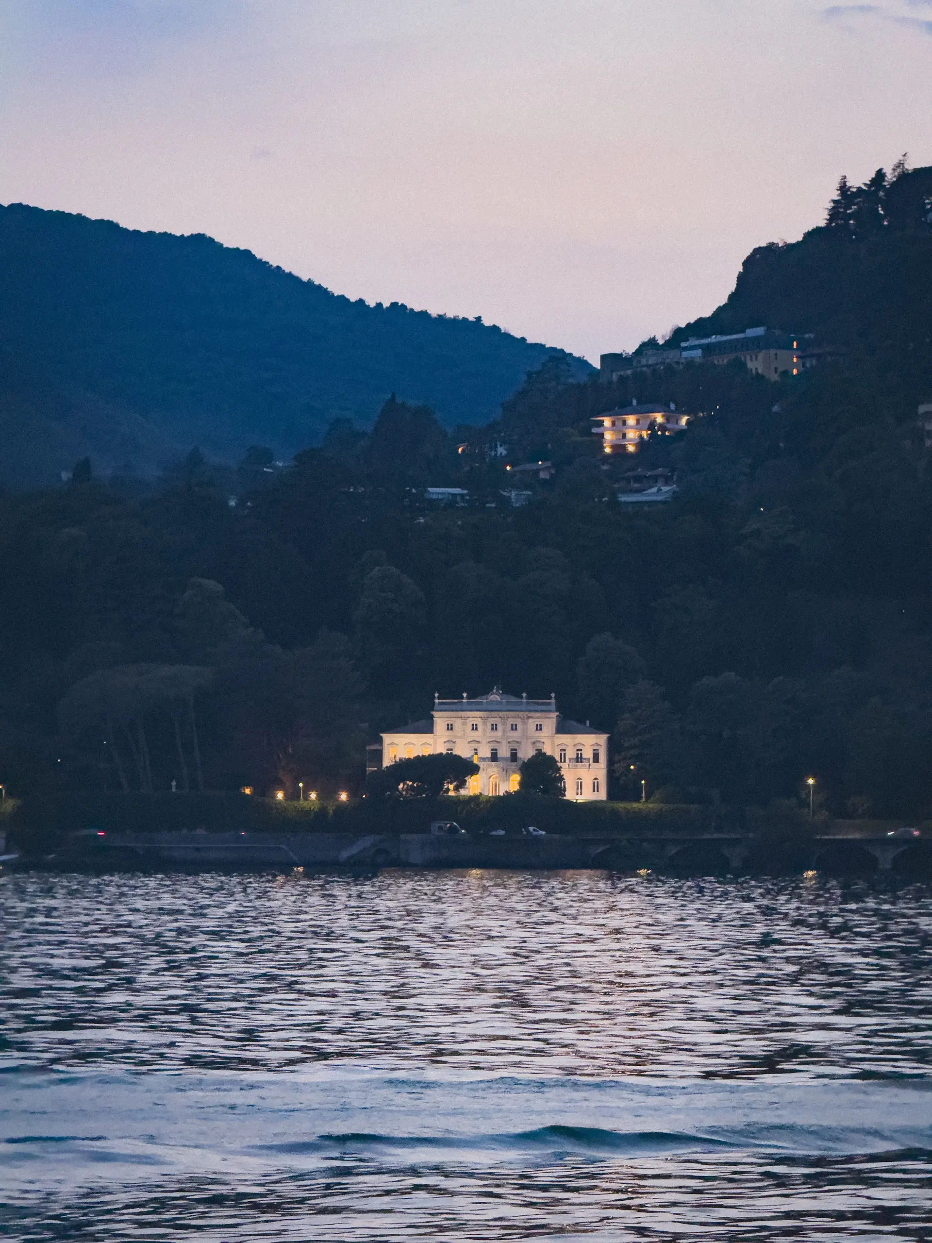 Private terrace overlooking still water at dusk