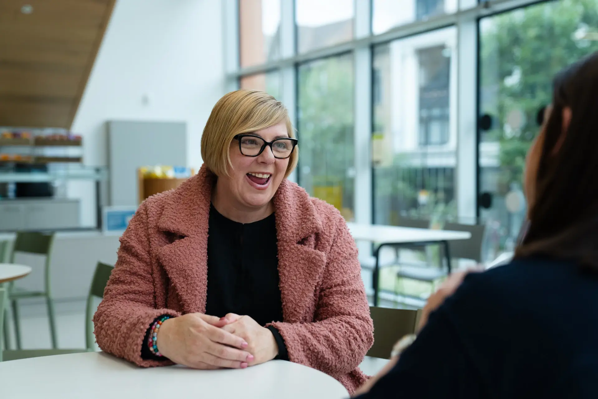 An Elite Pathways advisor speaking warmly with a student