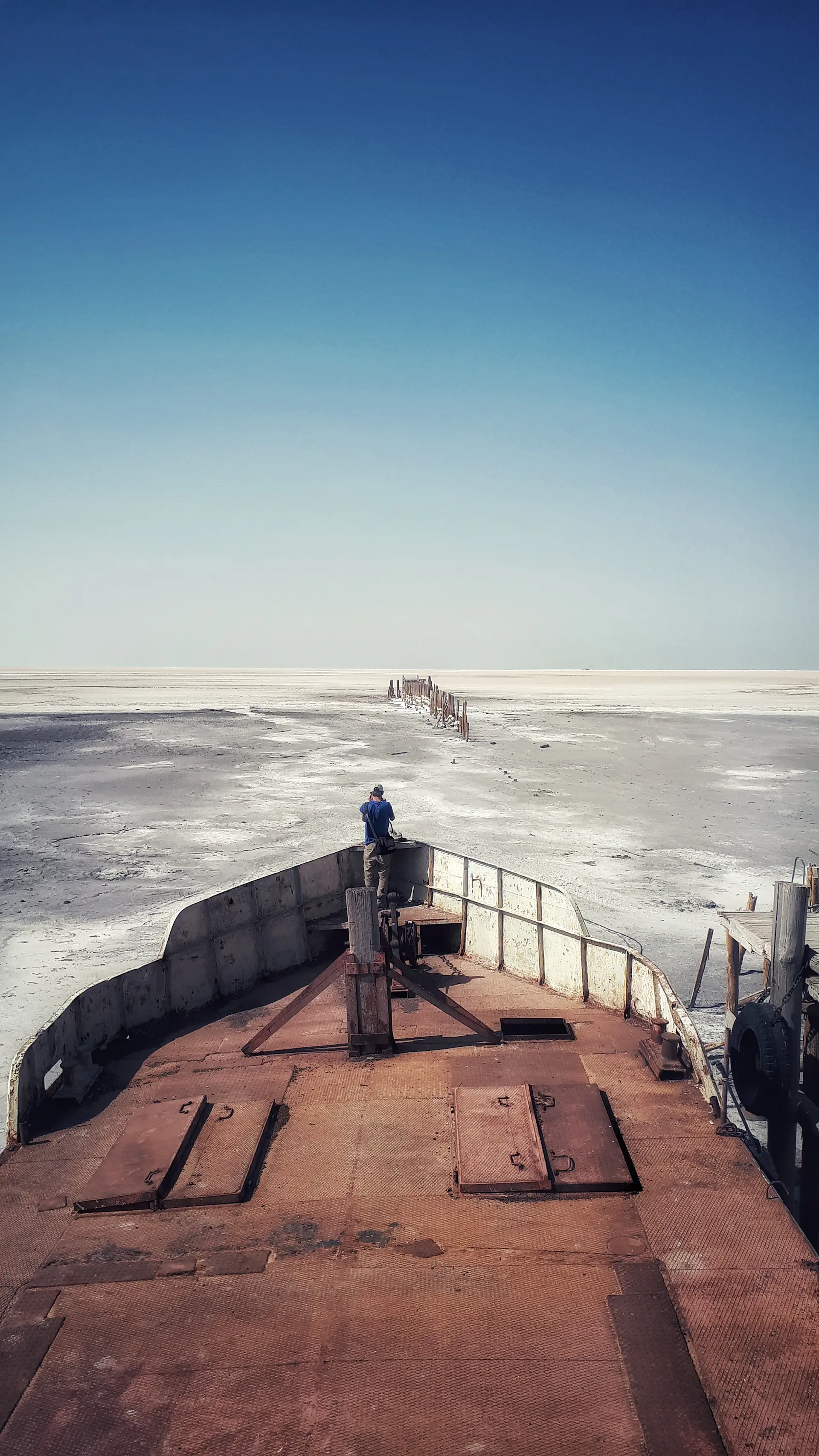 The vessel's open deck framed against drifting ice