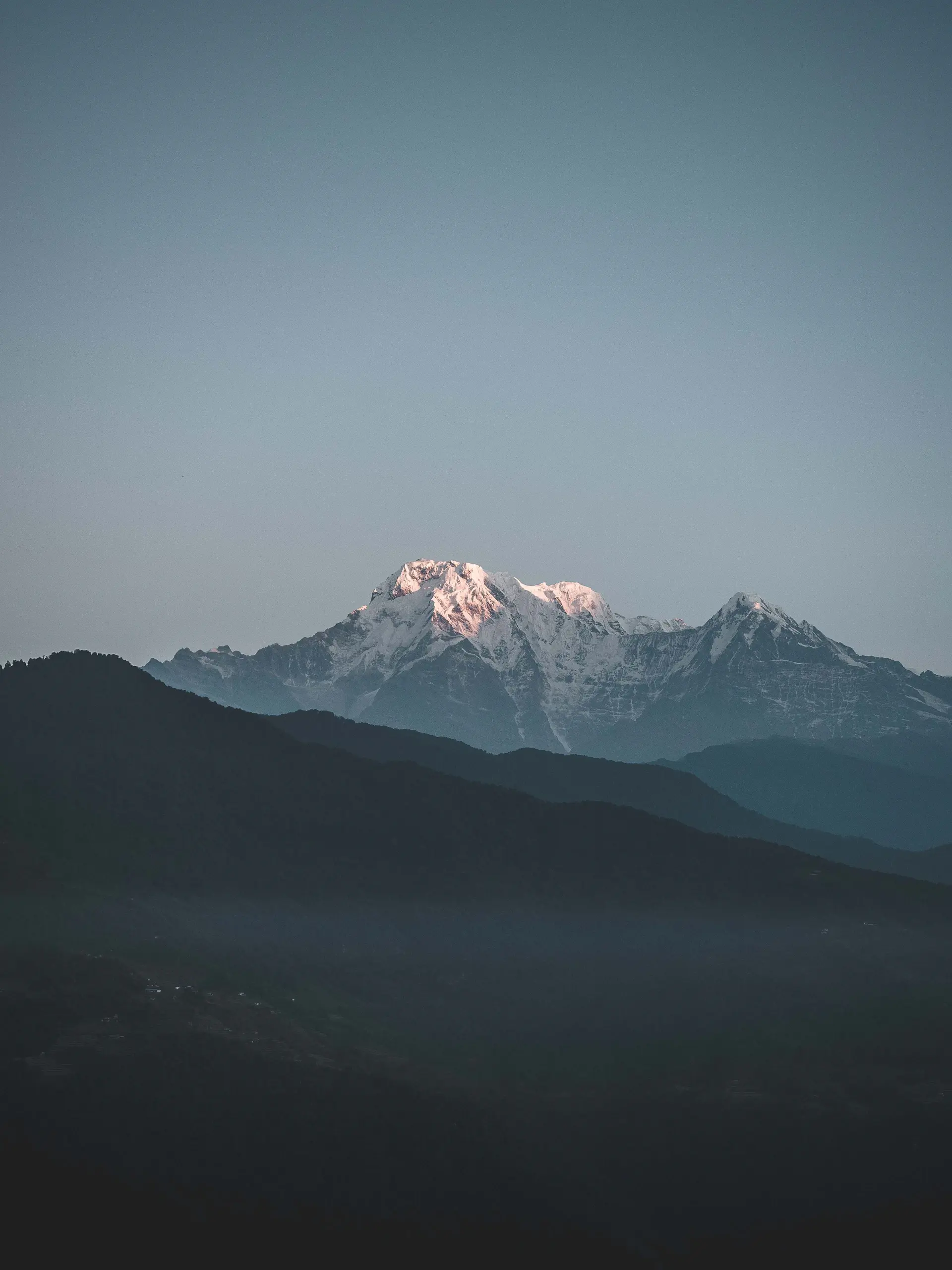 Snow-capped peaks at first light from a high camp
