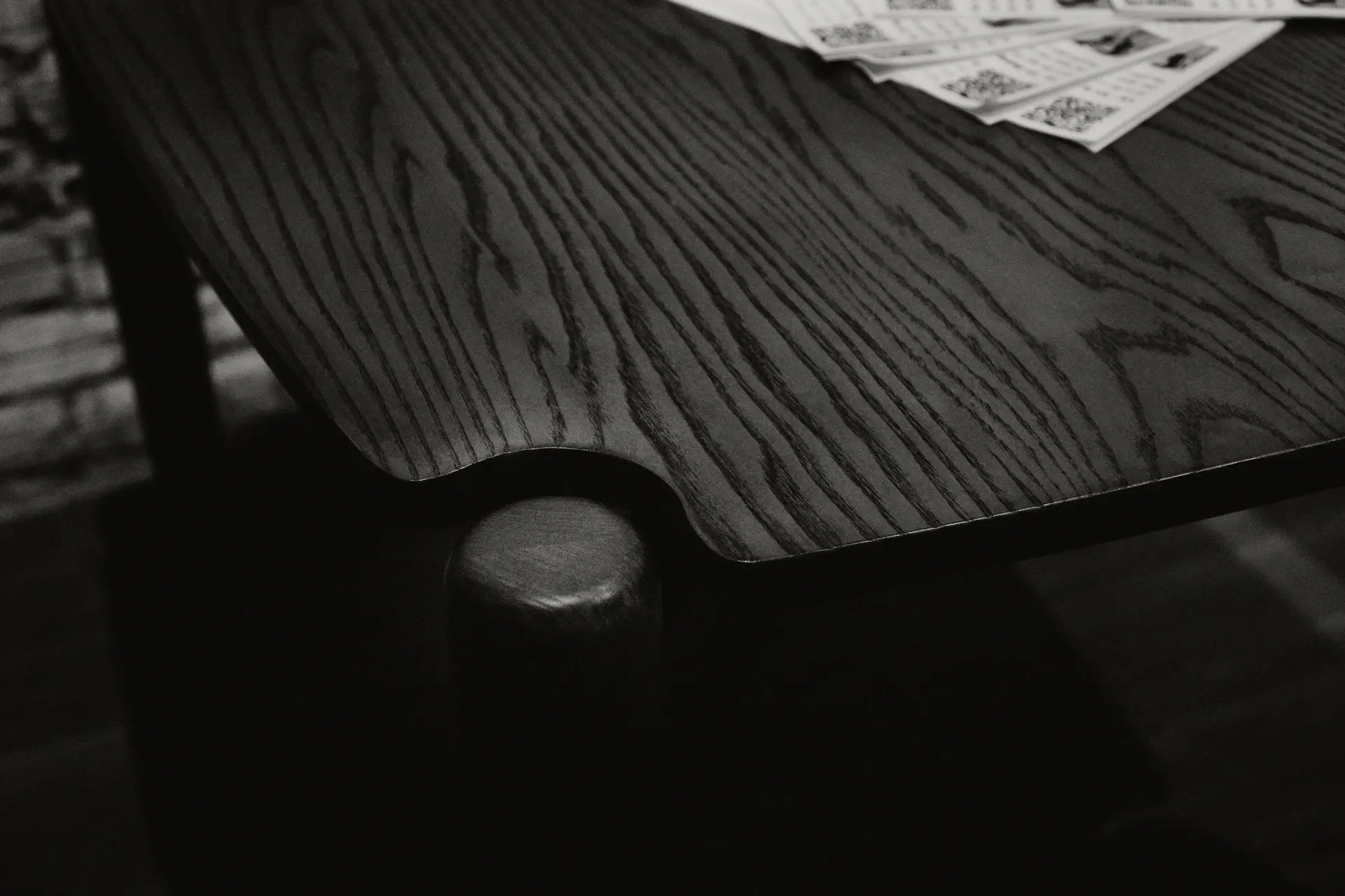 A printed copy of Nova Creative magazine on a wooden studio table