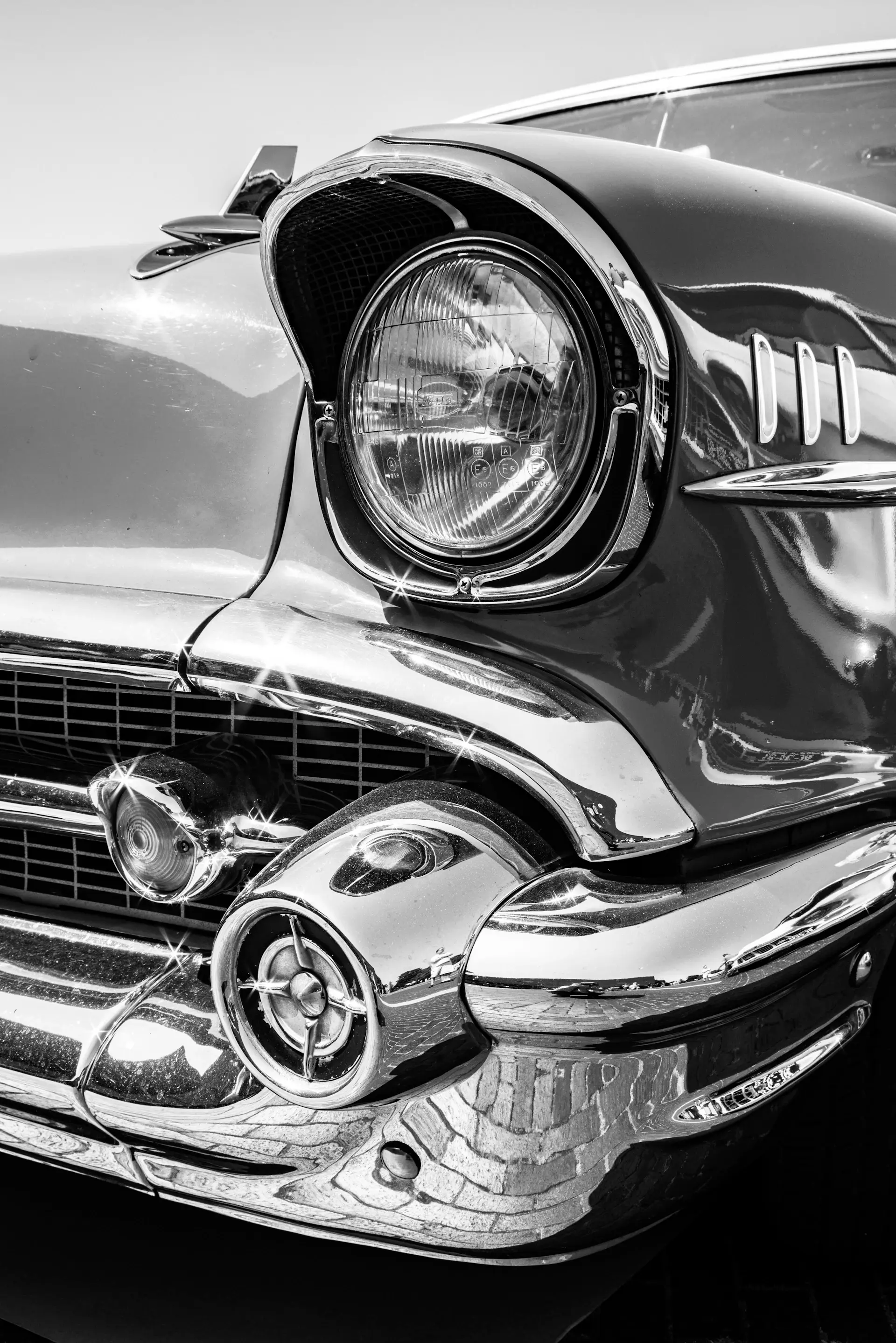 Detail study of the grand tourer's flowing rear haunch and chrome trim