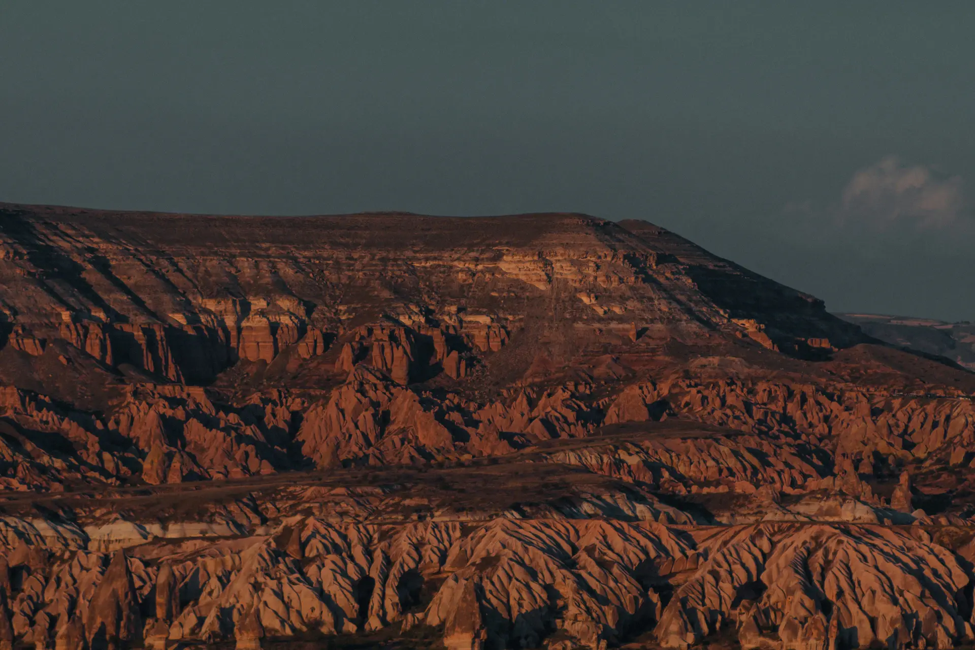 Dusk light fading over a wide untouched mountain wilderness
