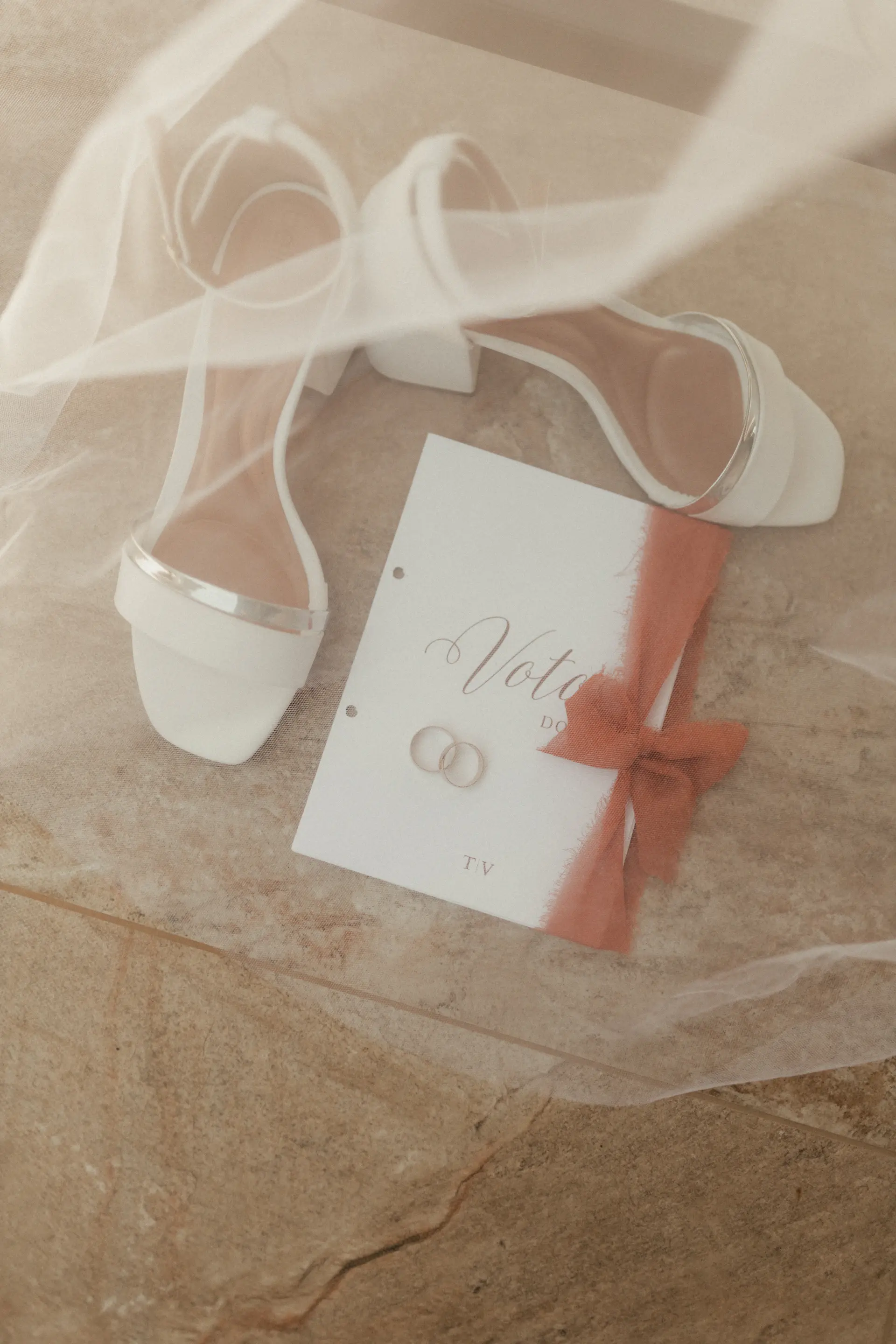 A planning desk with invitations and ribbon