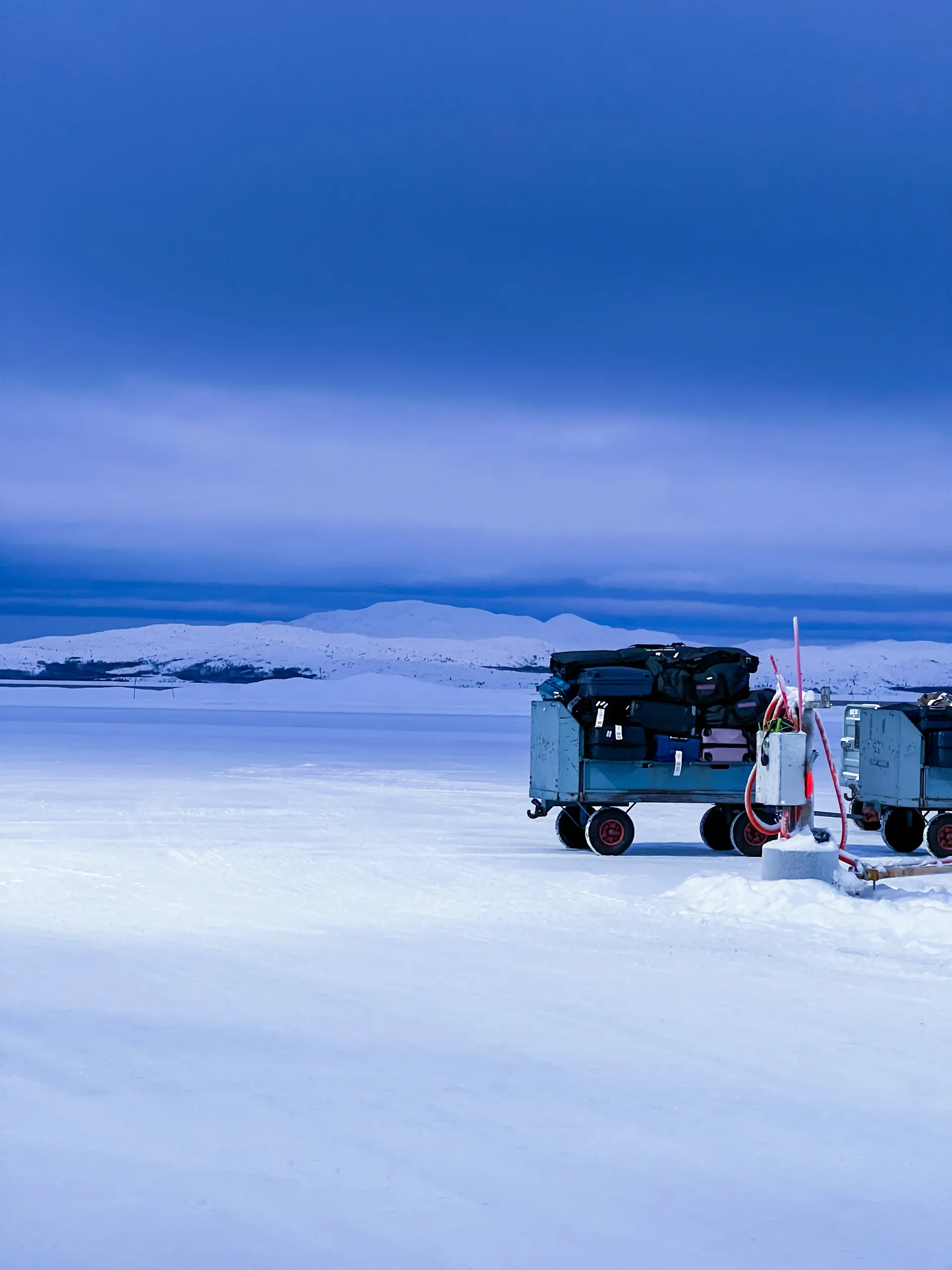 A private camp pitched on Antarctic fast ice at twilight