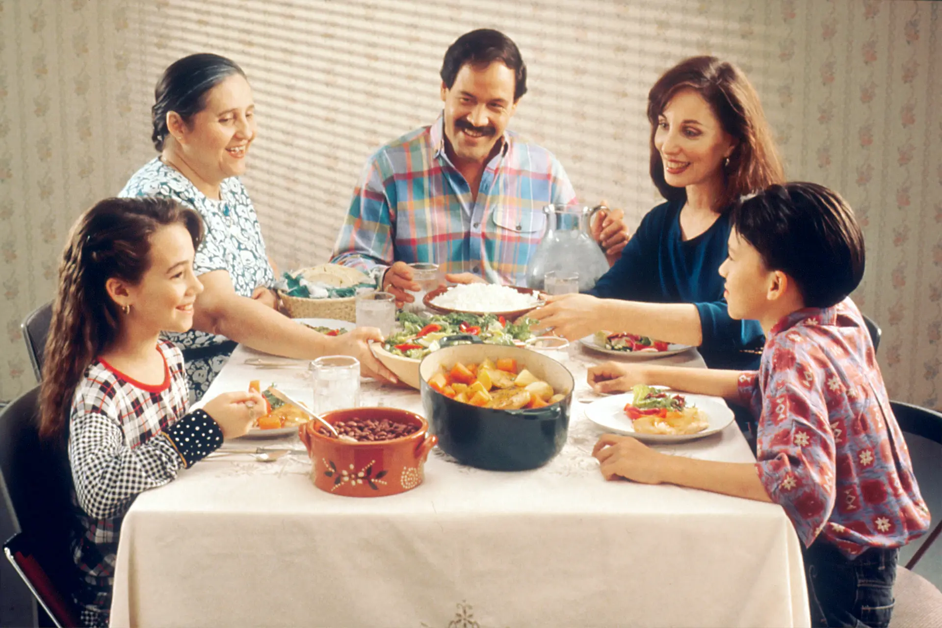 Student sharing a home-cooked dinner with a host family
