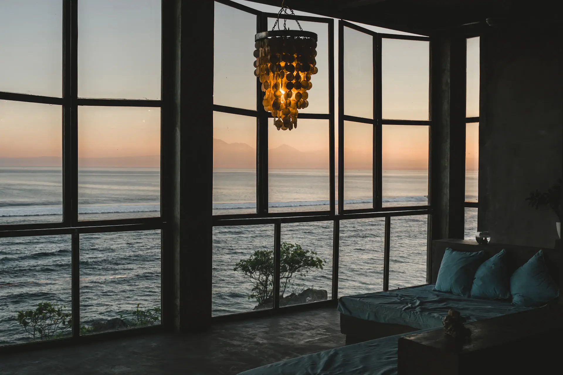 Architectural beachfront villa at golden hour