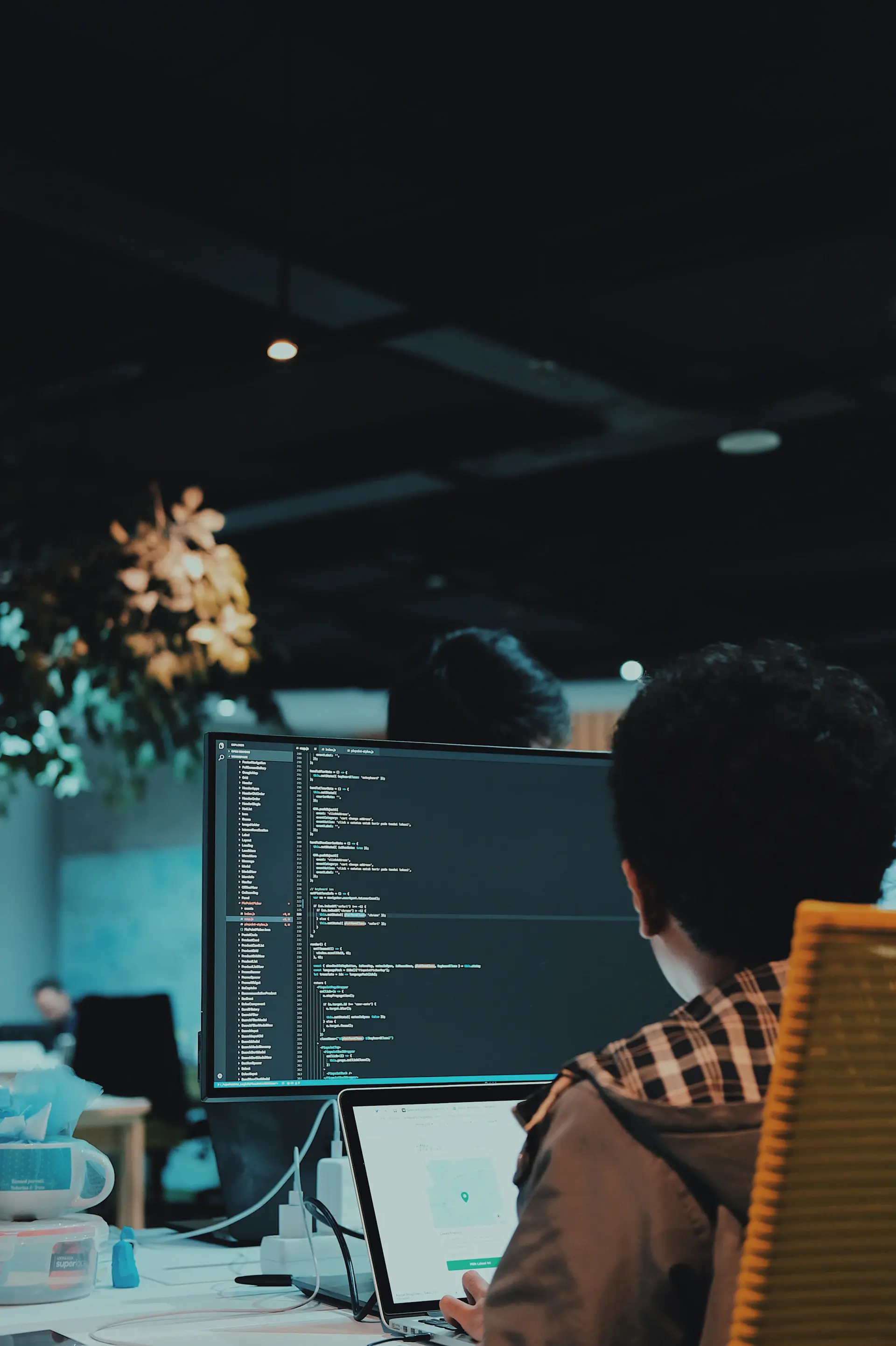 Developer pair-programming at a desk