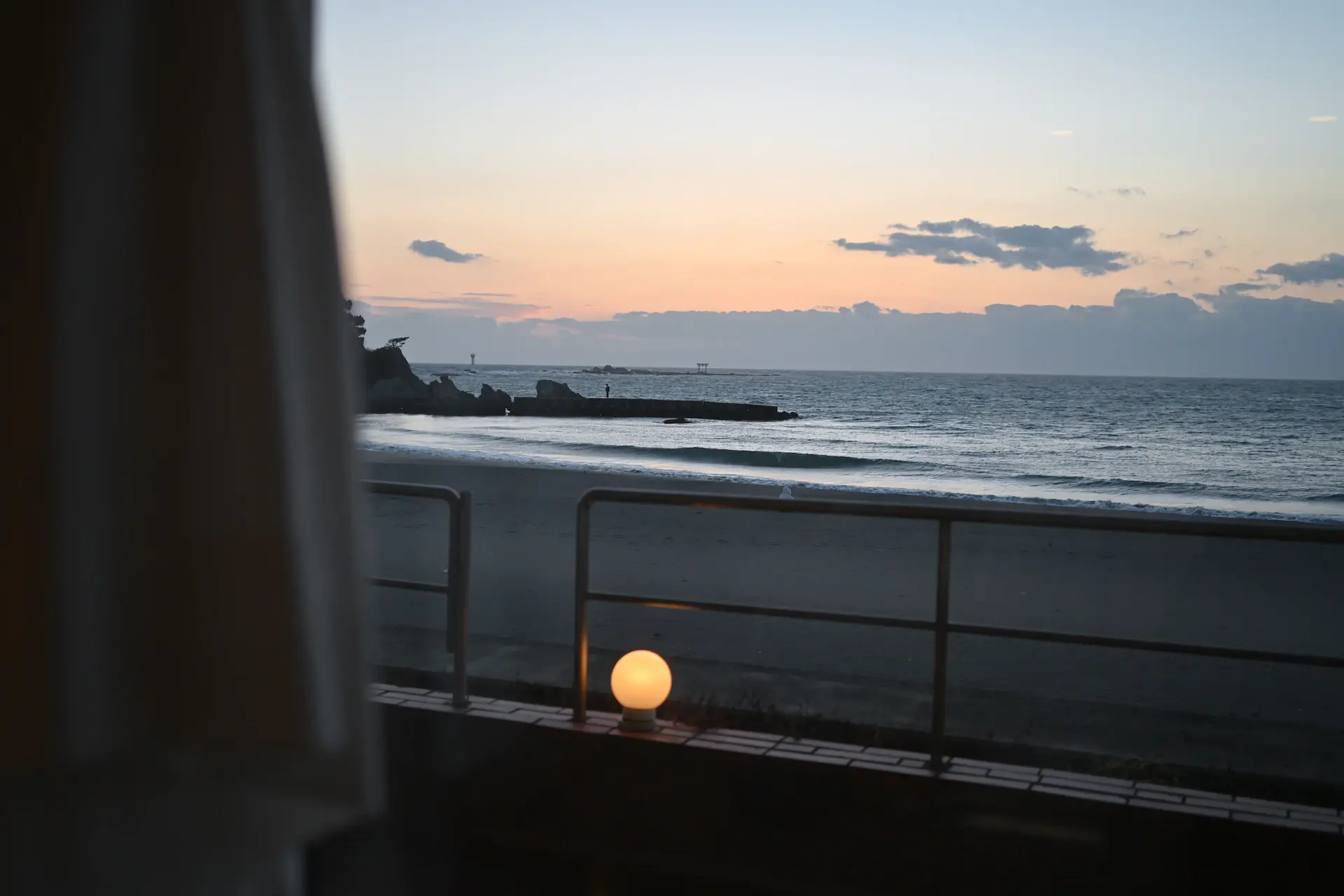 Private terrace at dusk overlooking the sea
