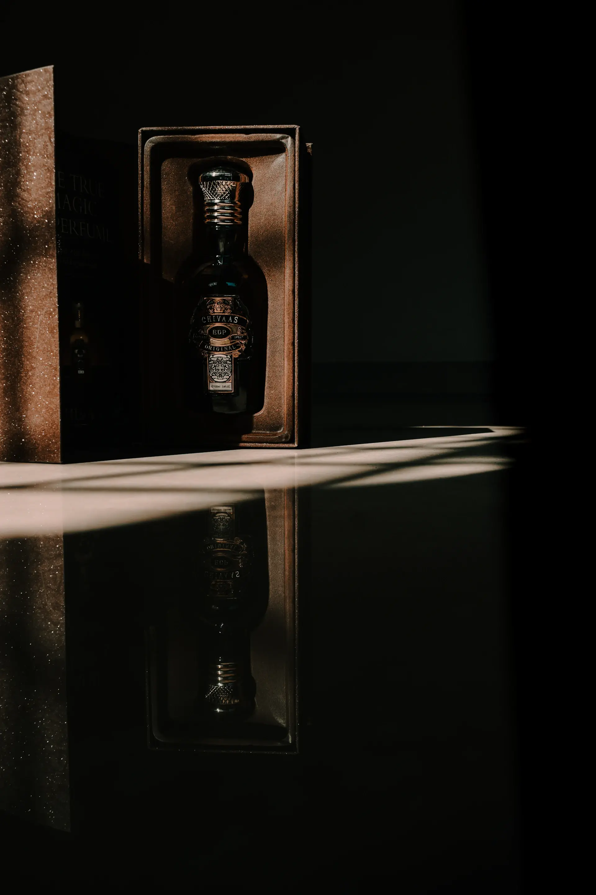 A premium ribboned gift box holding a rare bottle