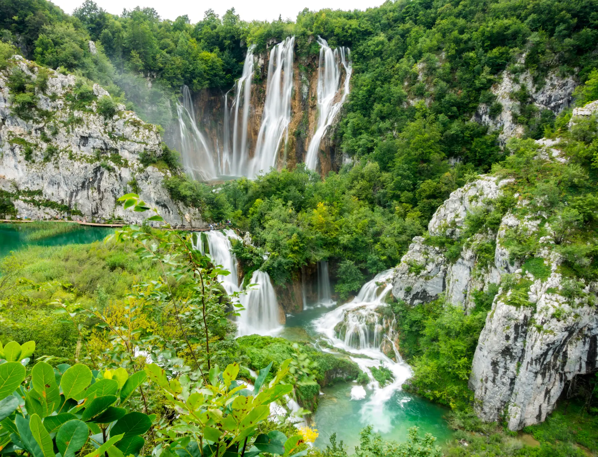 Veils of water cascading over travertine terraces