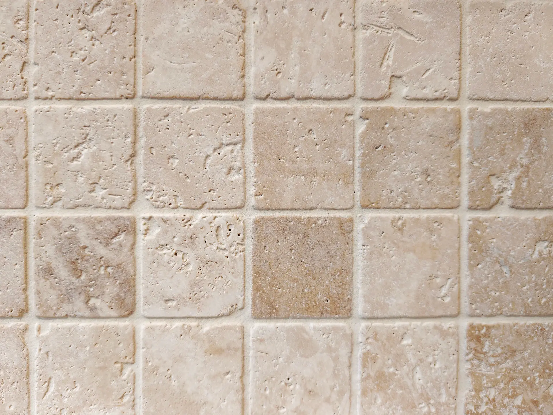 Honed travertine wall catching afternoon light