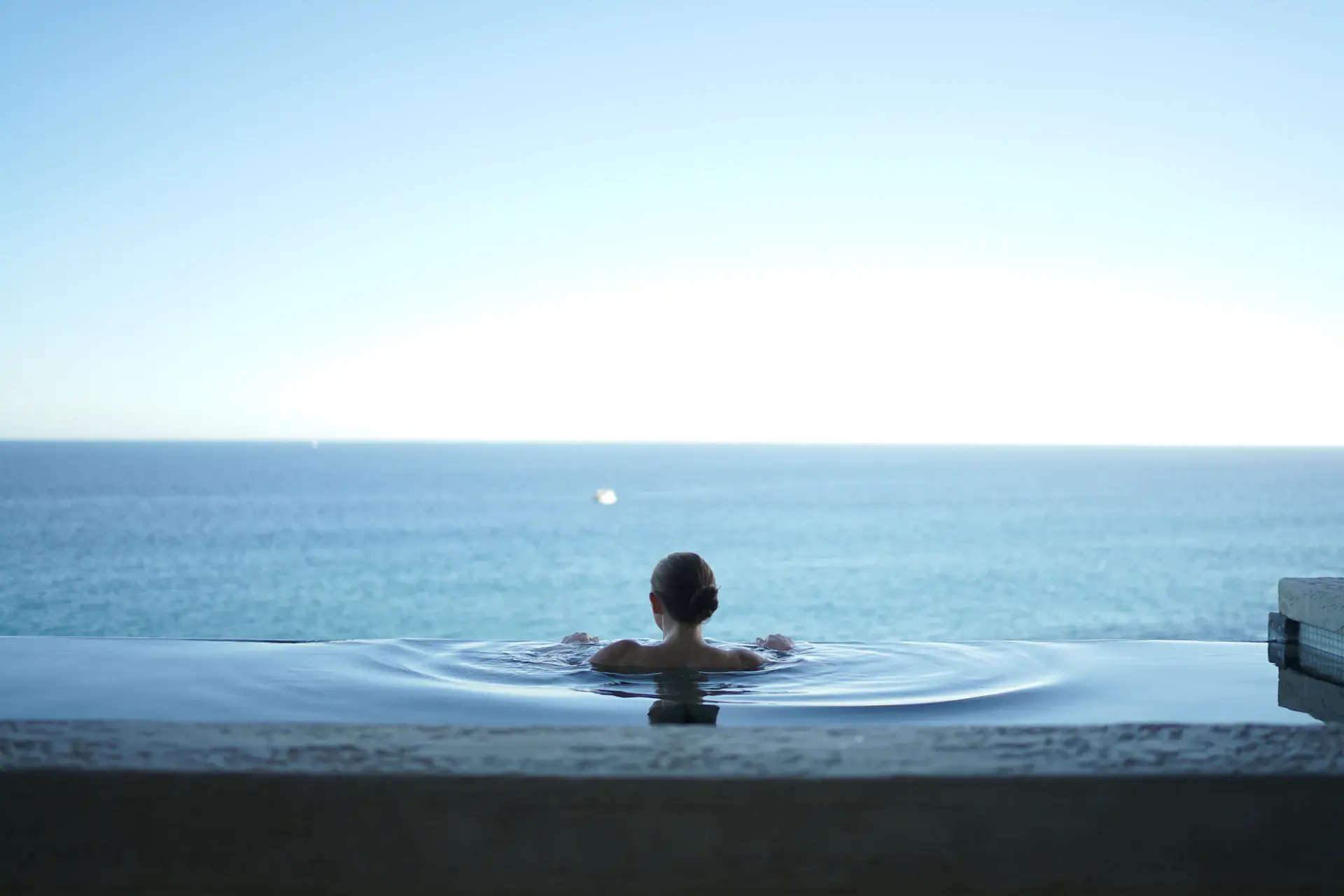 Infinity pool meeting the horizon at the edge of the terrace