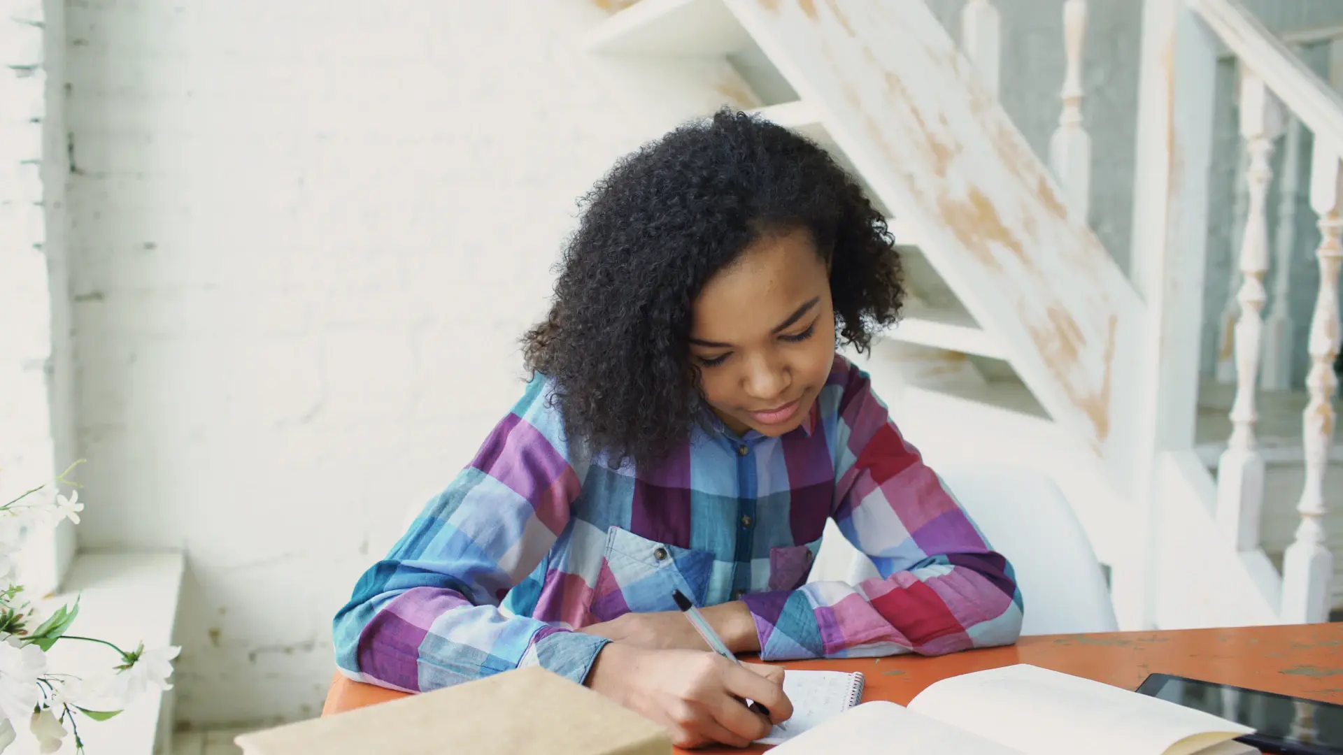 Aspiring student reviewing scholarship offers at an elegant study desk