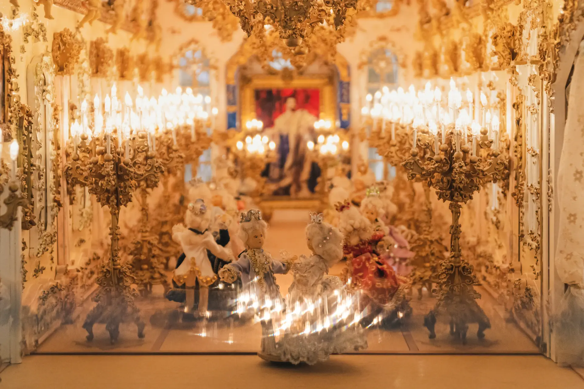 Candlelit reception with warm uplighting reflecting off mirrored walls