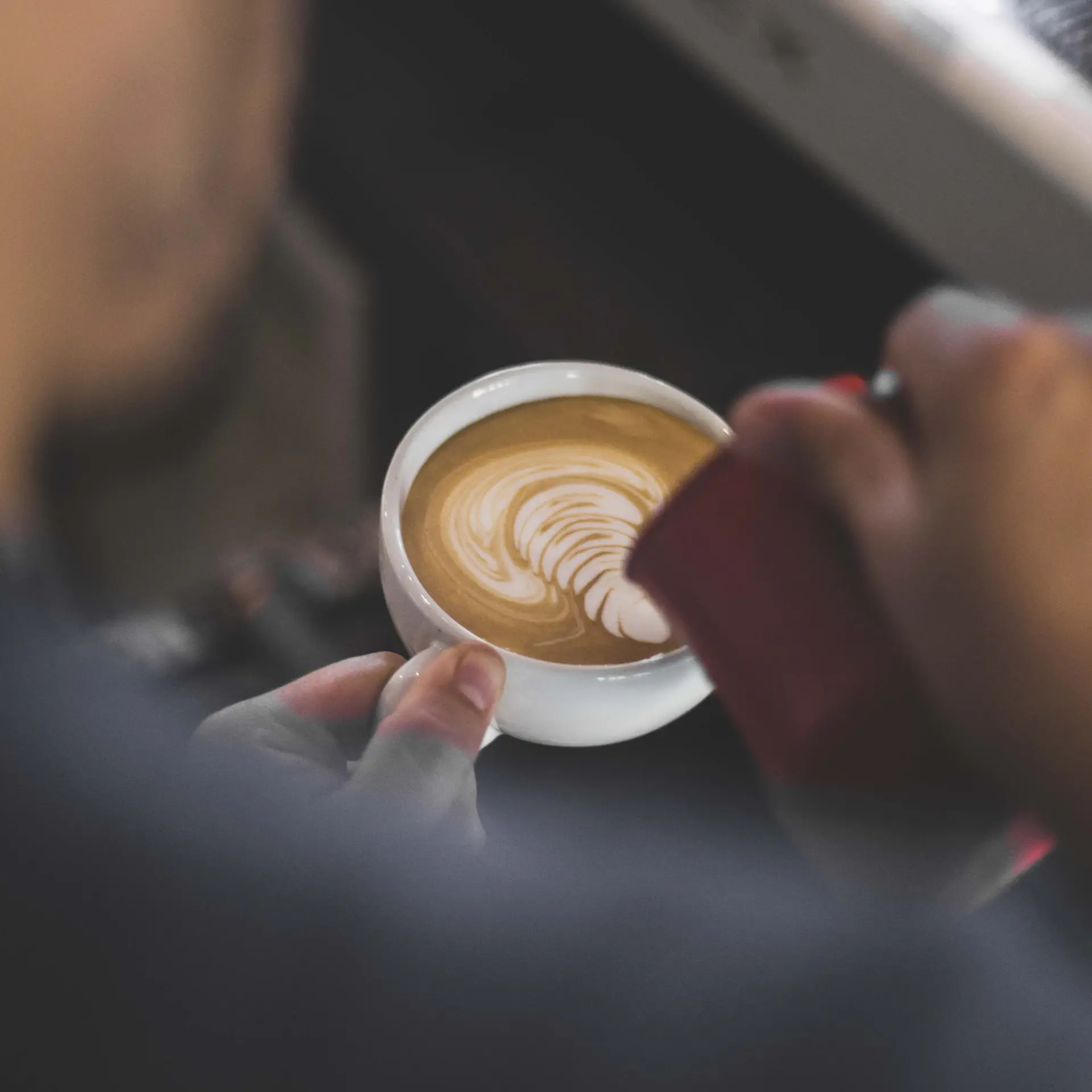 Latte art tulip in a ceramic cup