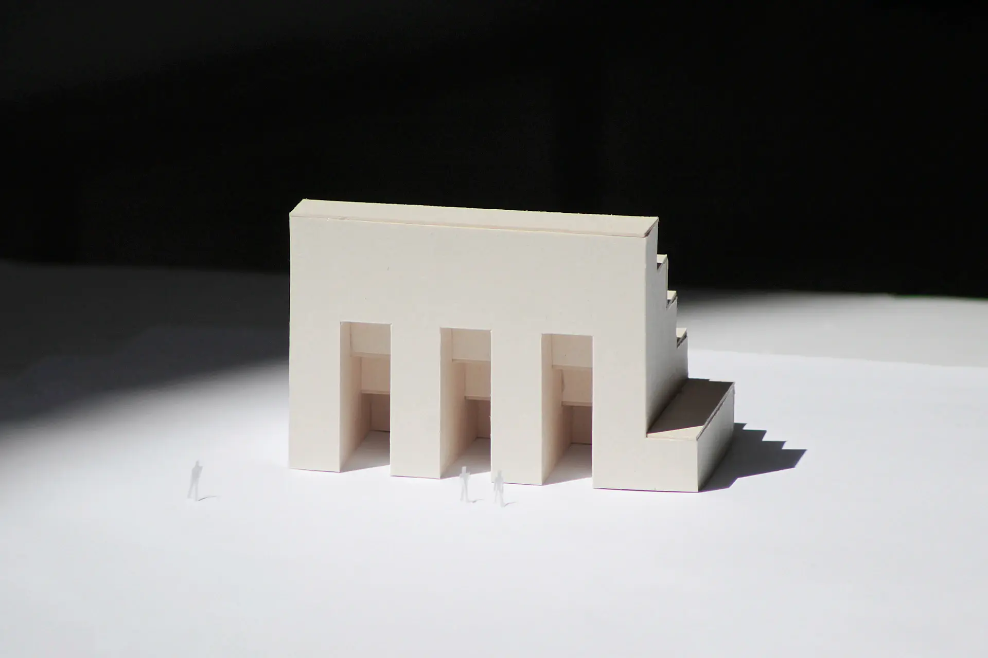 Minimalist study with financial documents and architectural model