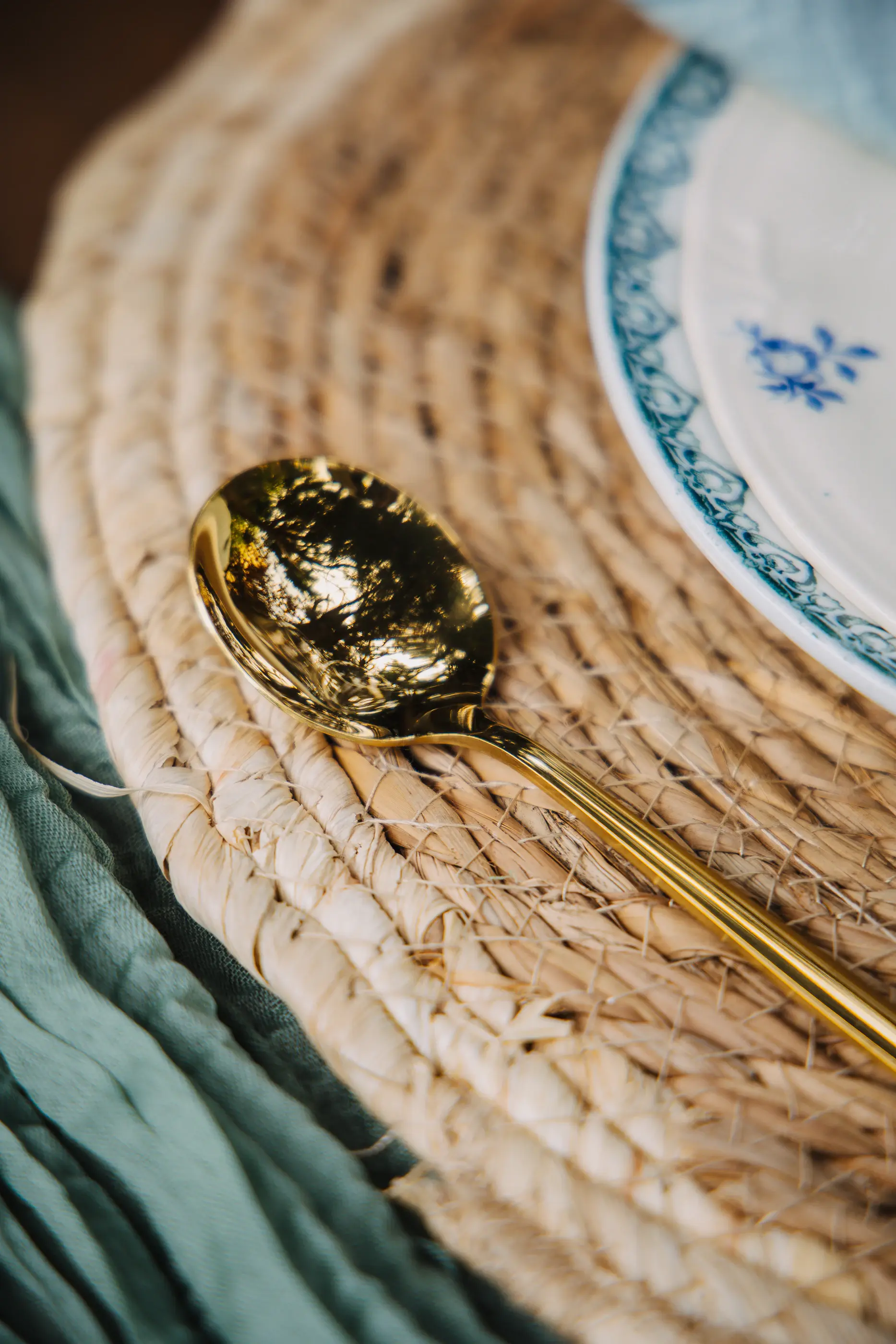 Gold cutlery on linen place setting