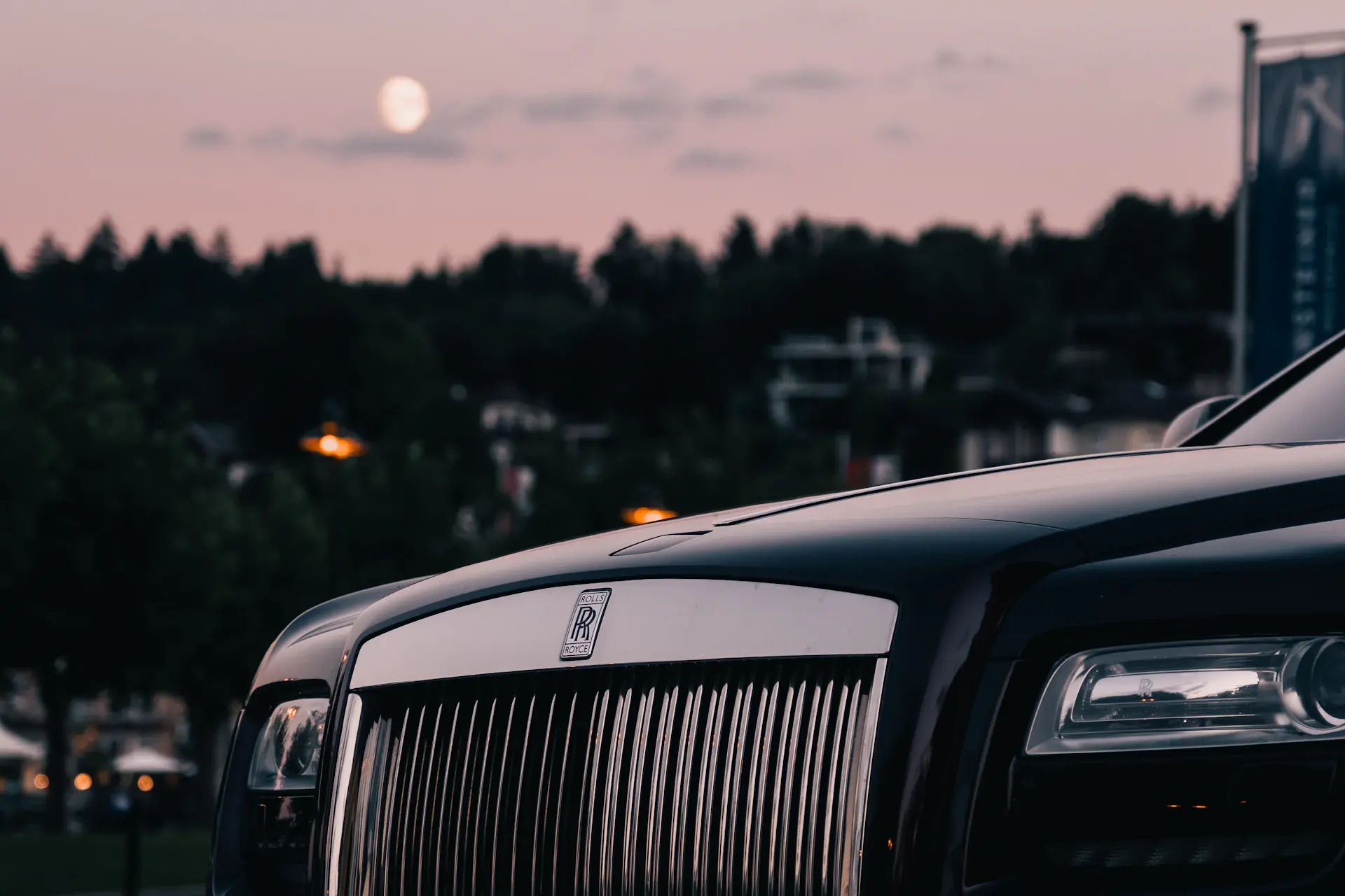 The Aurelia Convertible with roof lowered at dusk