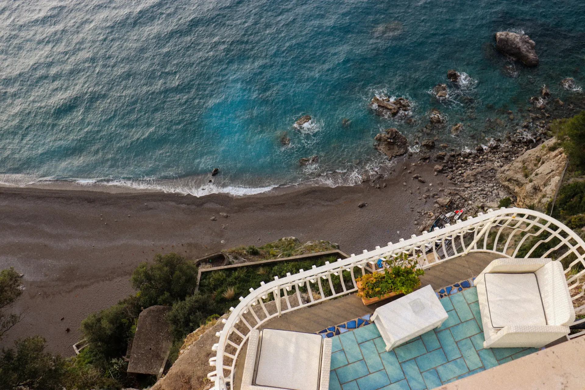 Principal suite with private terrace facing the water