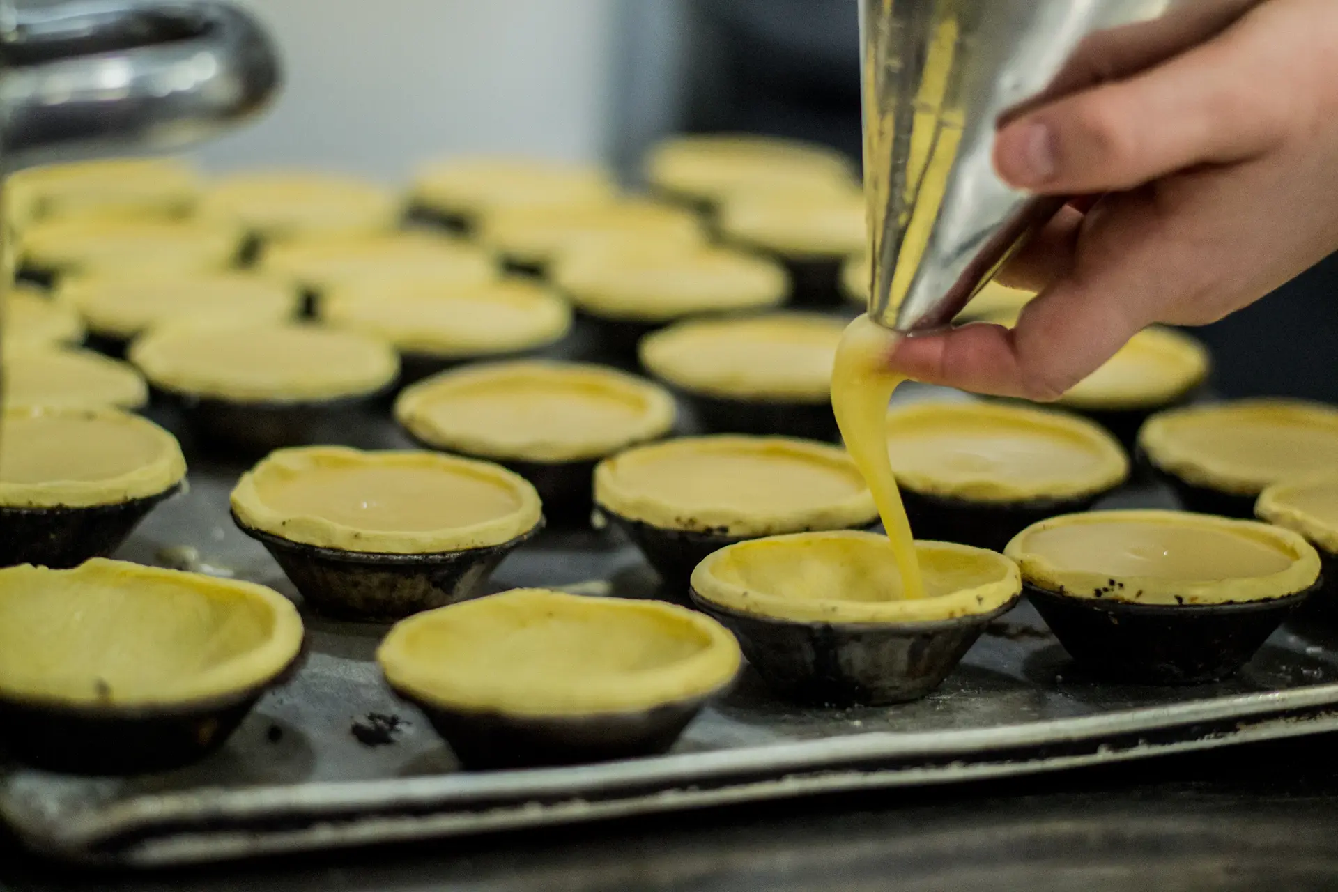 Pour-over coffee beside a lemon tart