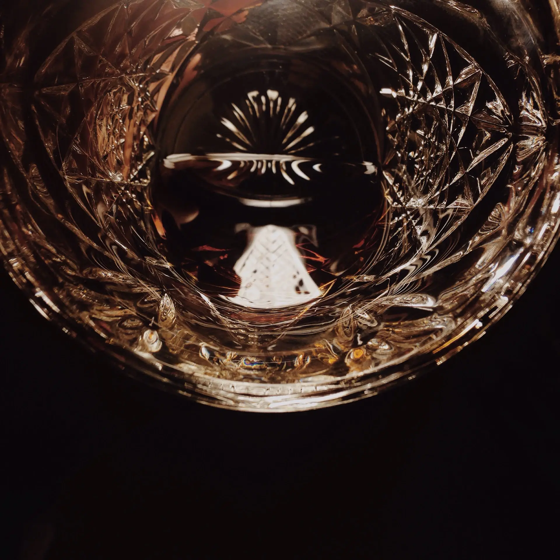 A glass of amber spirit swirled to release aroma