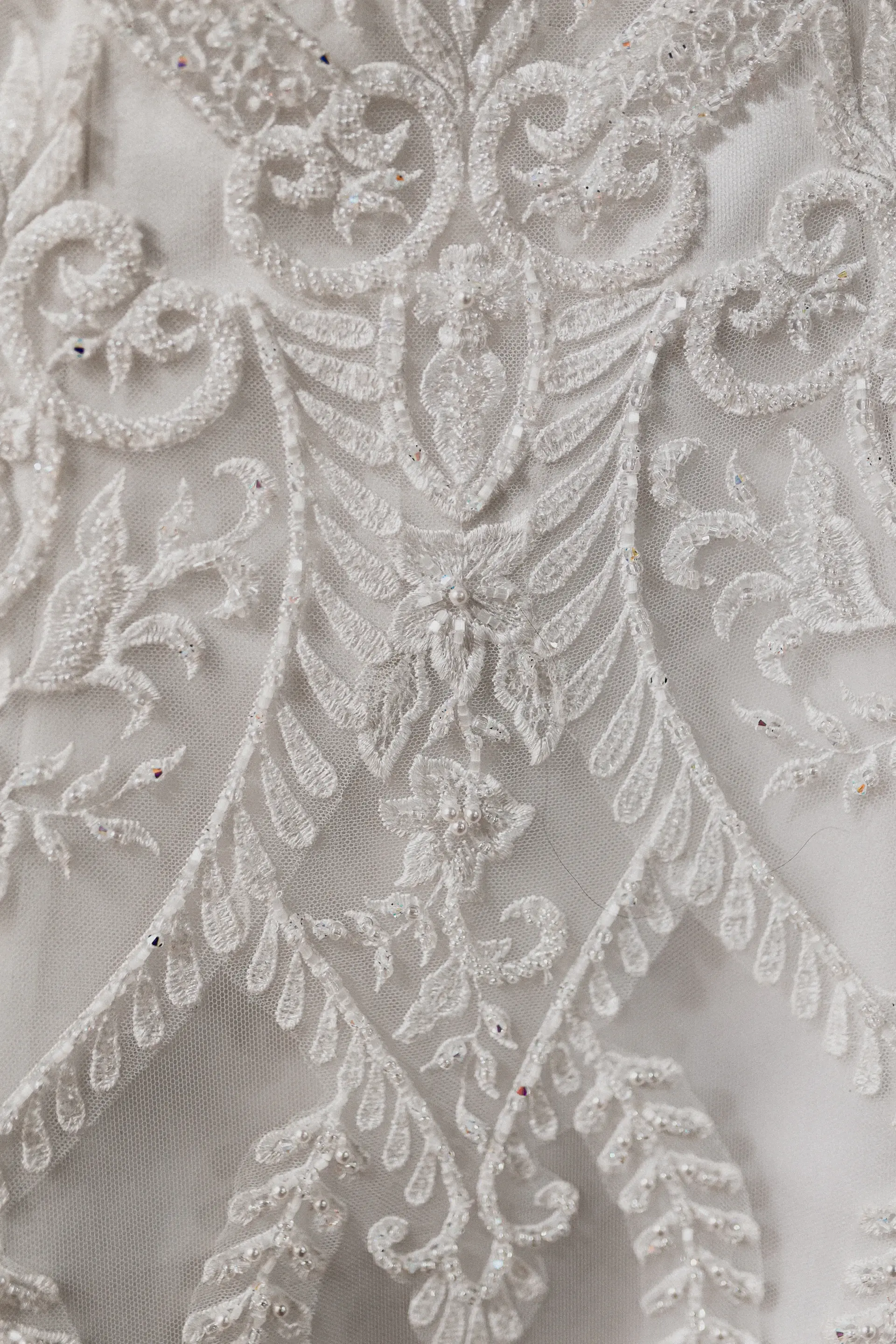 Close-up of lace gown embroidery