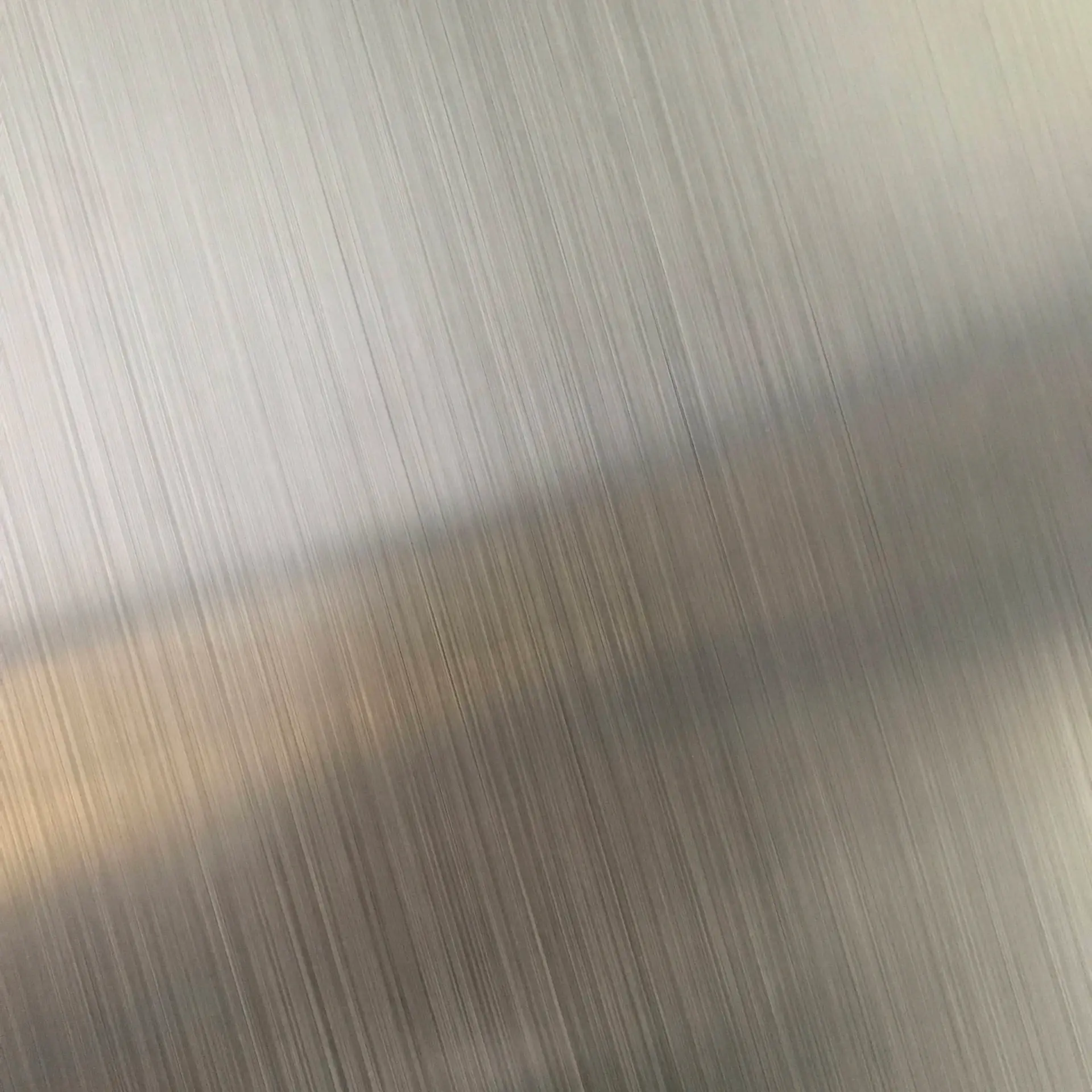 Macro of cool brushed silver metal surface