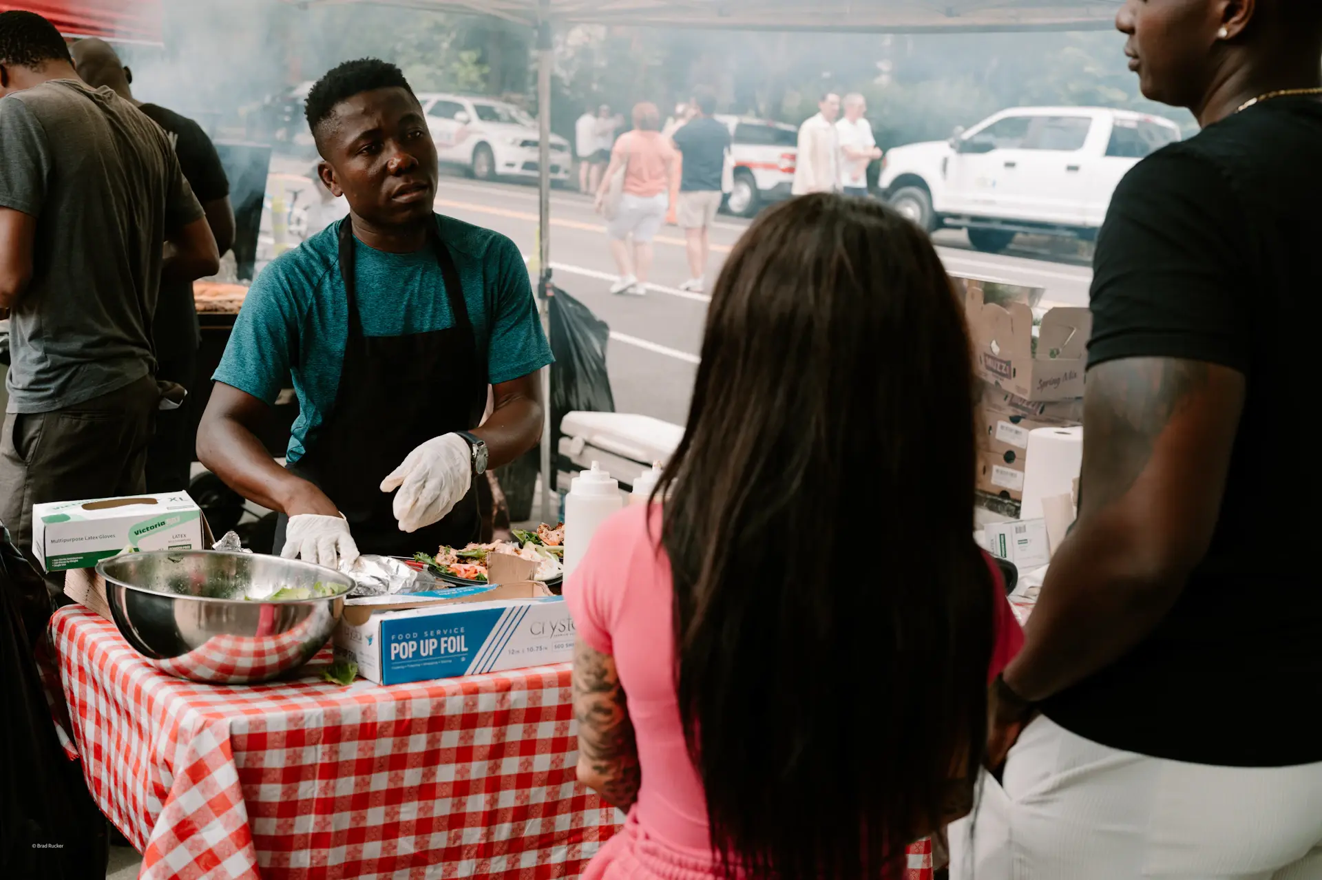 Friends sharing food at an outdoor market