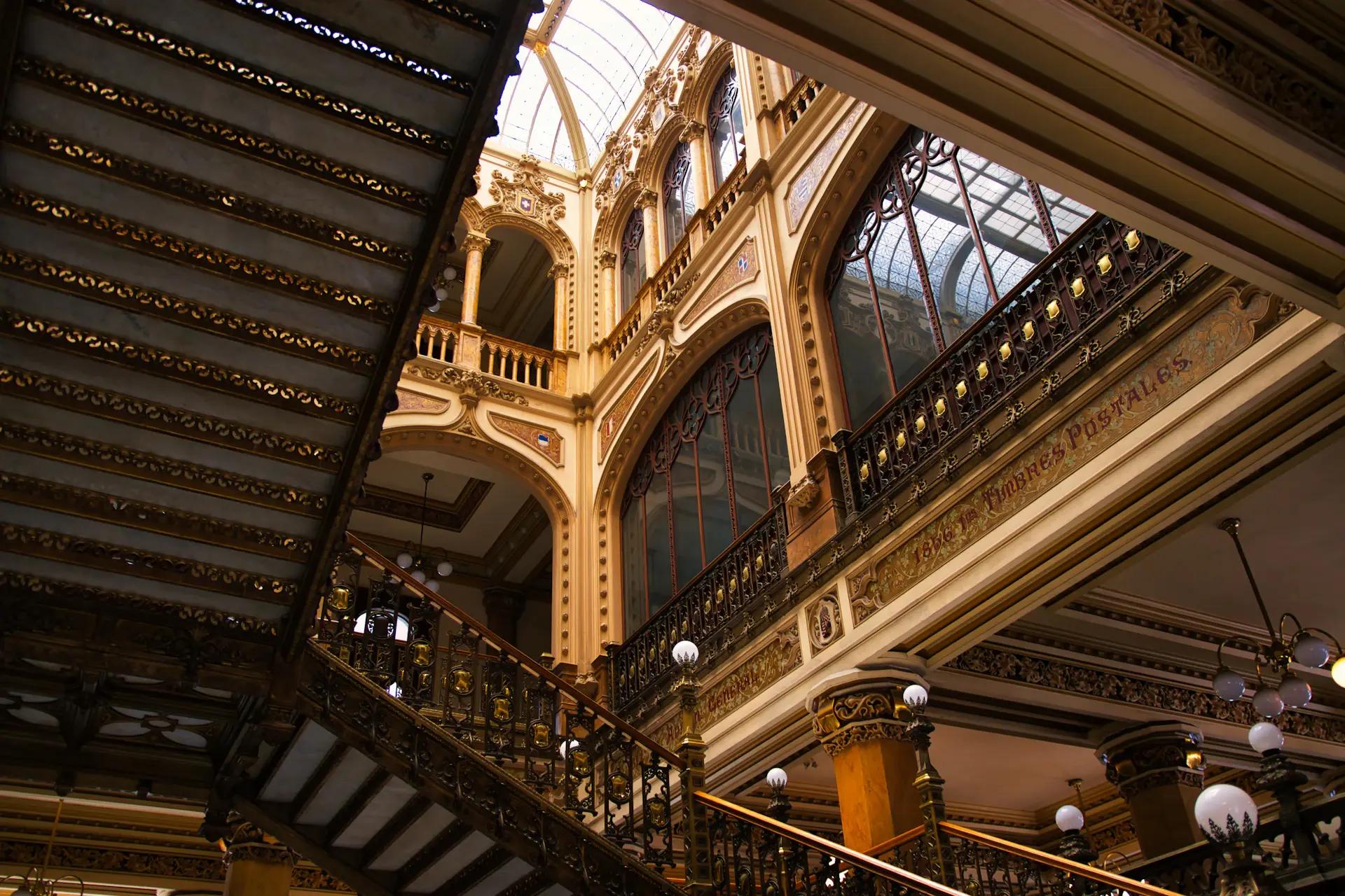 Ornate palace staircase and gilded columns
