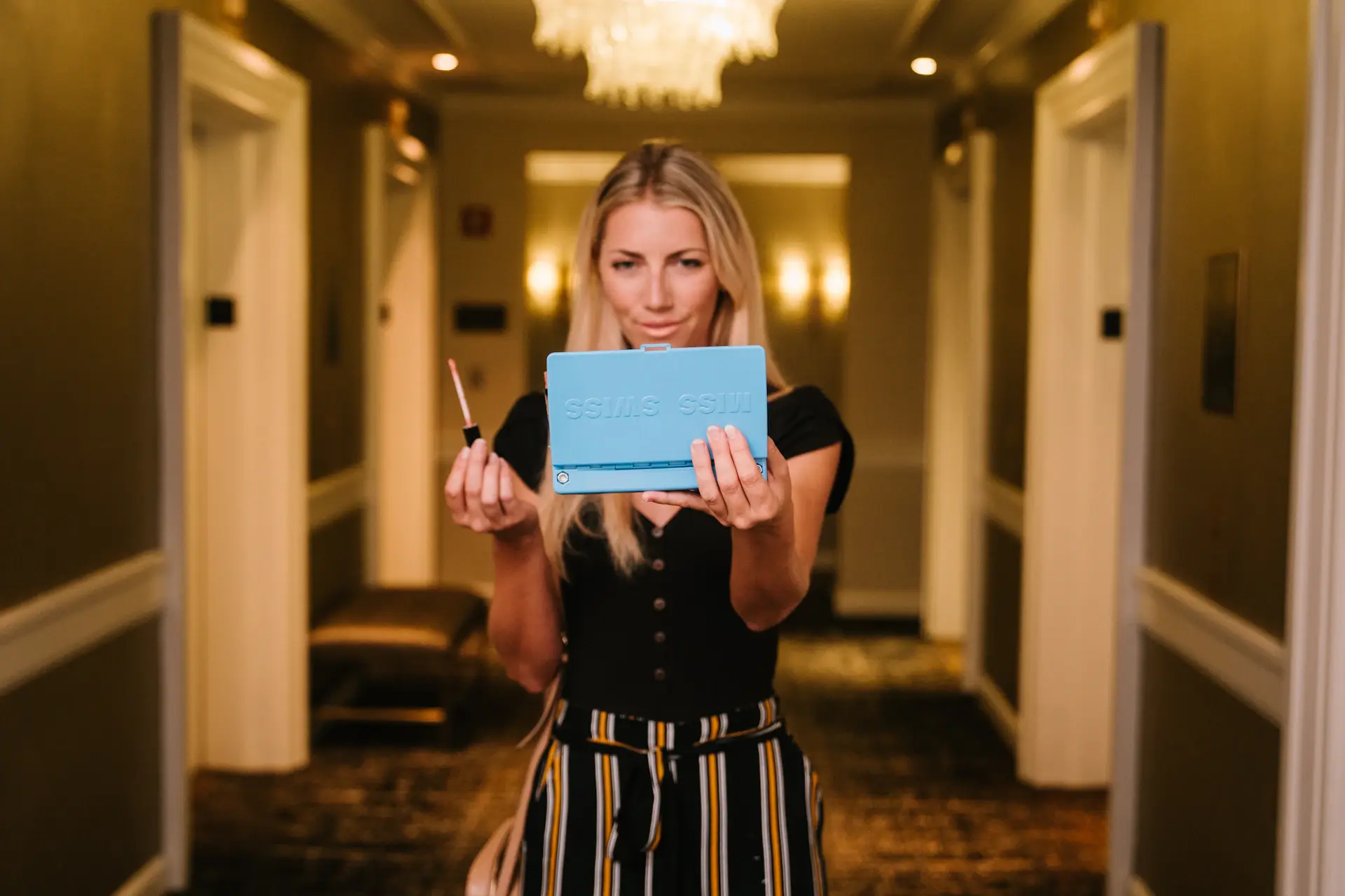 Smiling student holding an acceptance letter