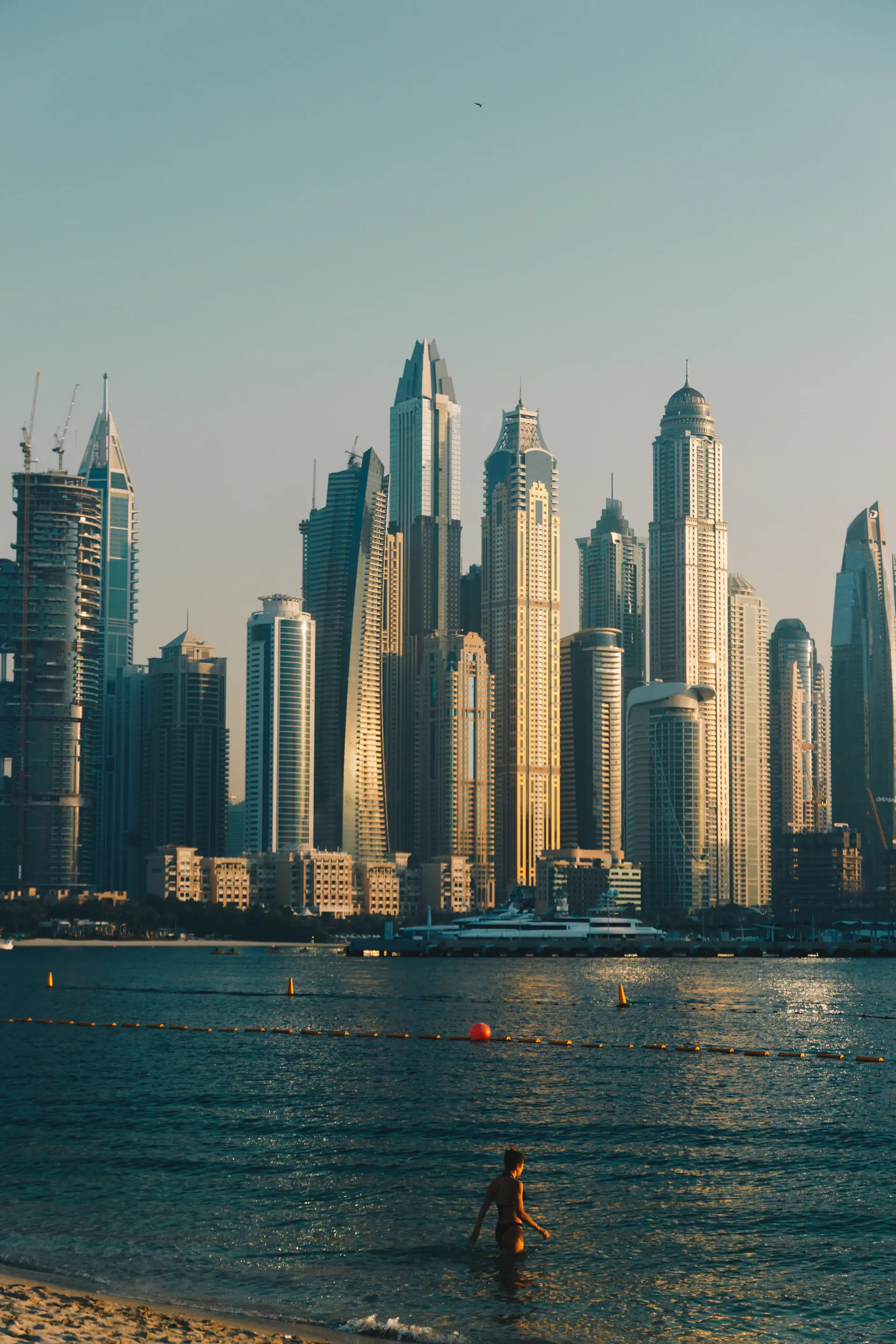 Marina Cove waterfront penthouses overlooking moored yachts at dusk