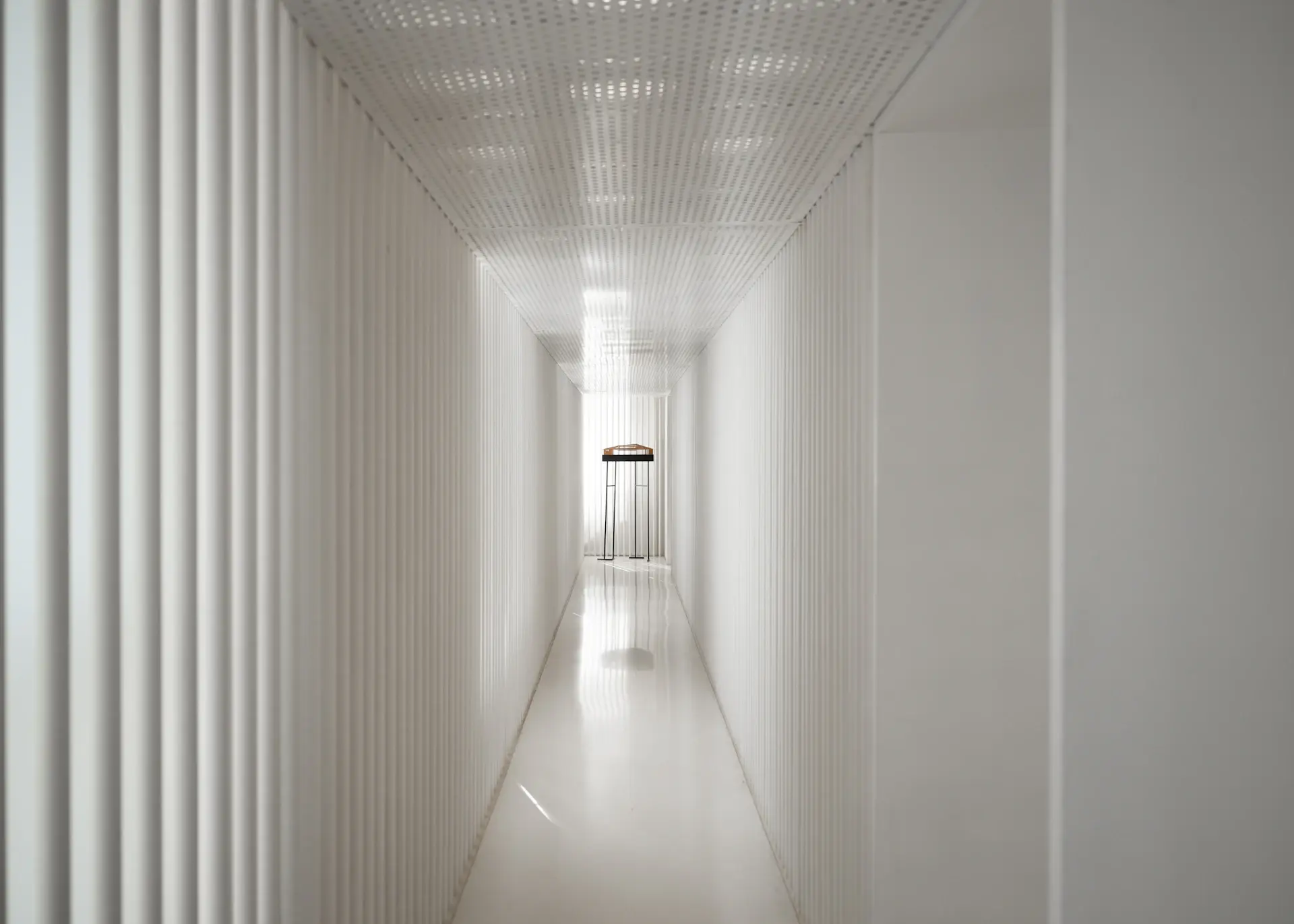 Calm clinic corridor in soft ivory light
