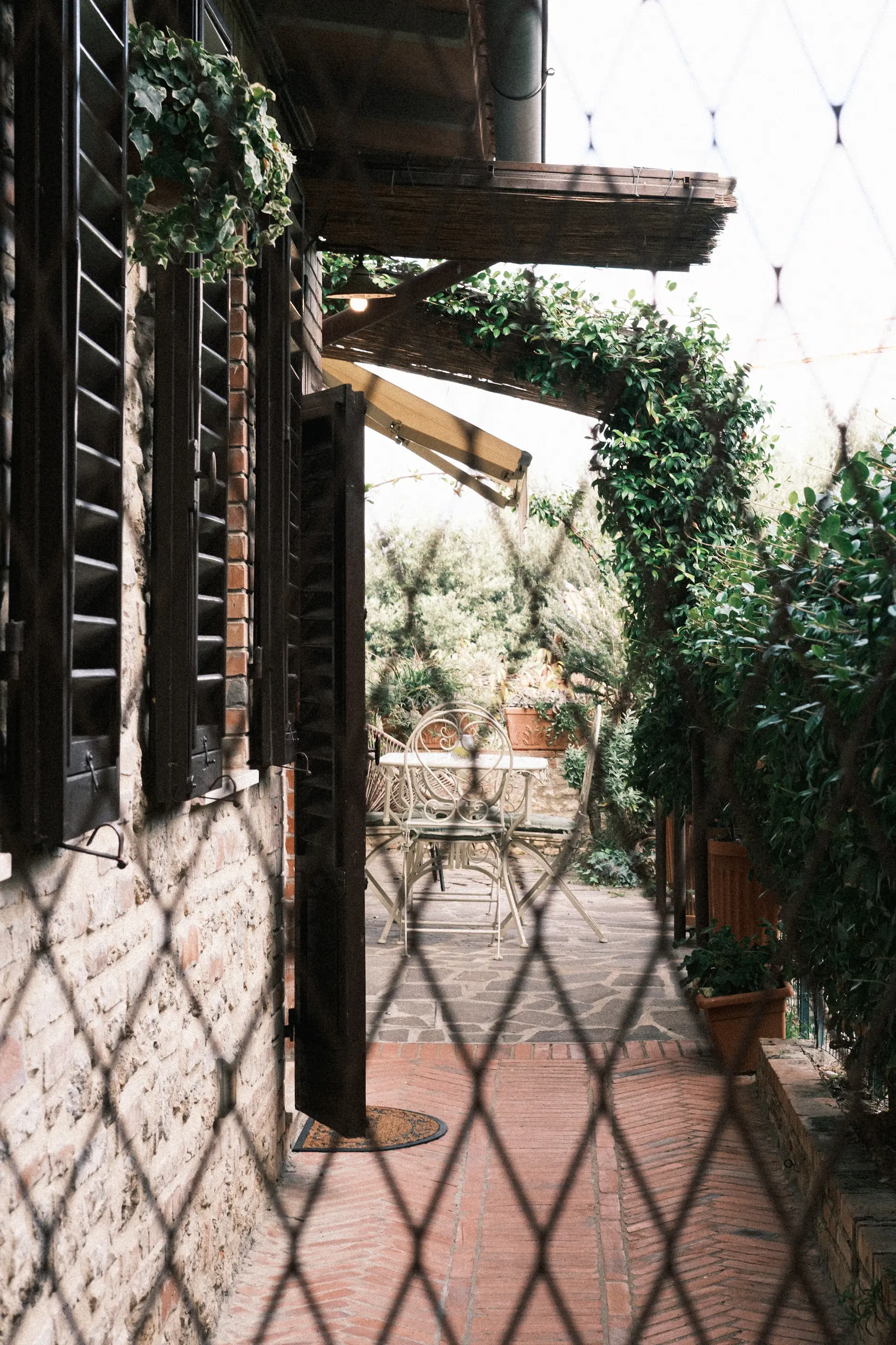 A garden terrace arranged for an outdoor wedding at golden hour