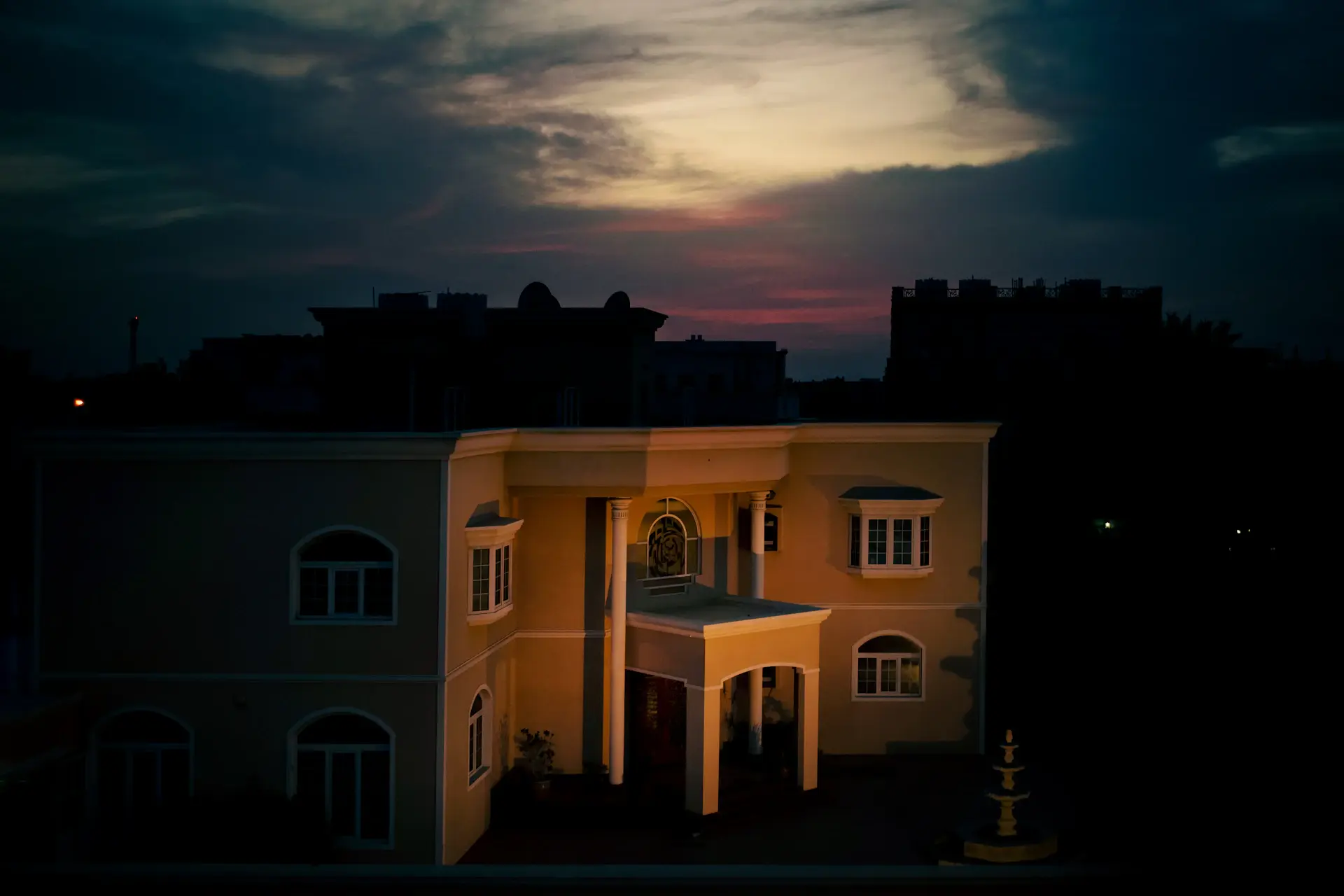 Archival view of the house's first residence at dawn