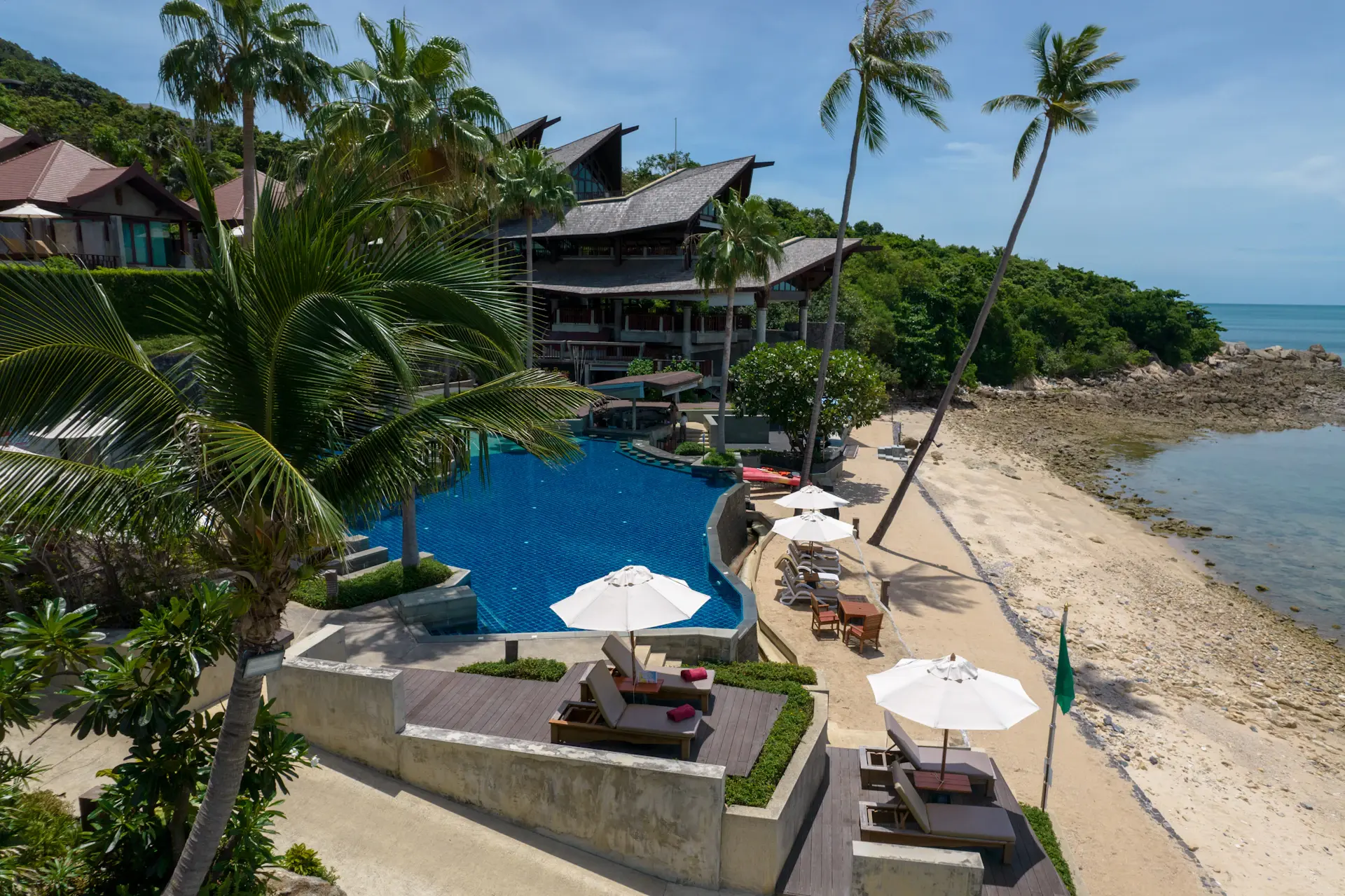 Beachfront residence above a private cove
