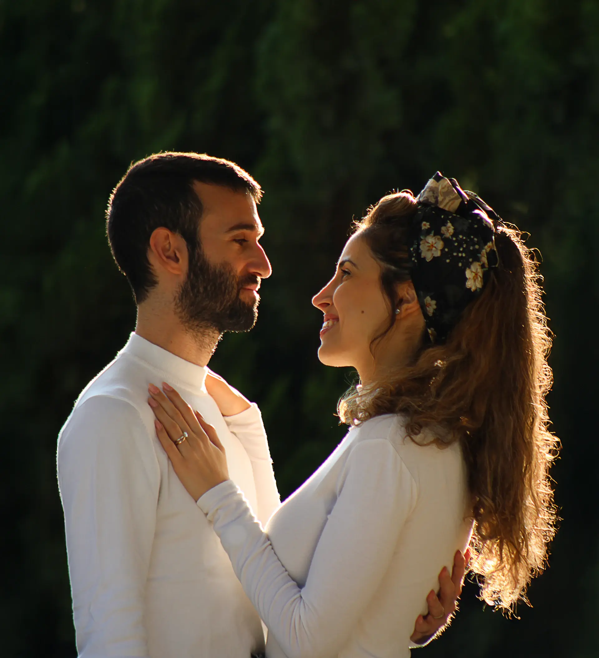 A newlywed couple smiling together outdoors