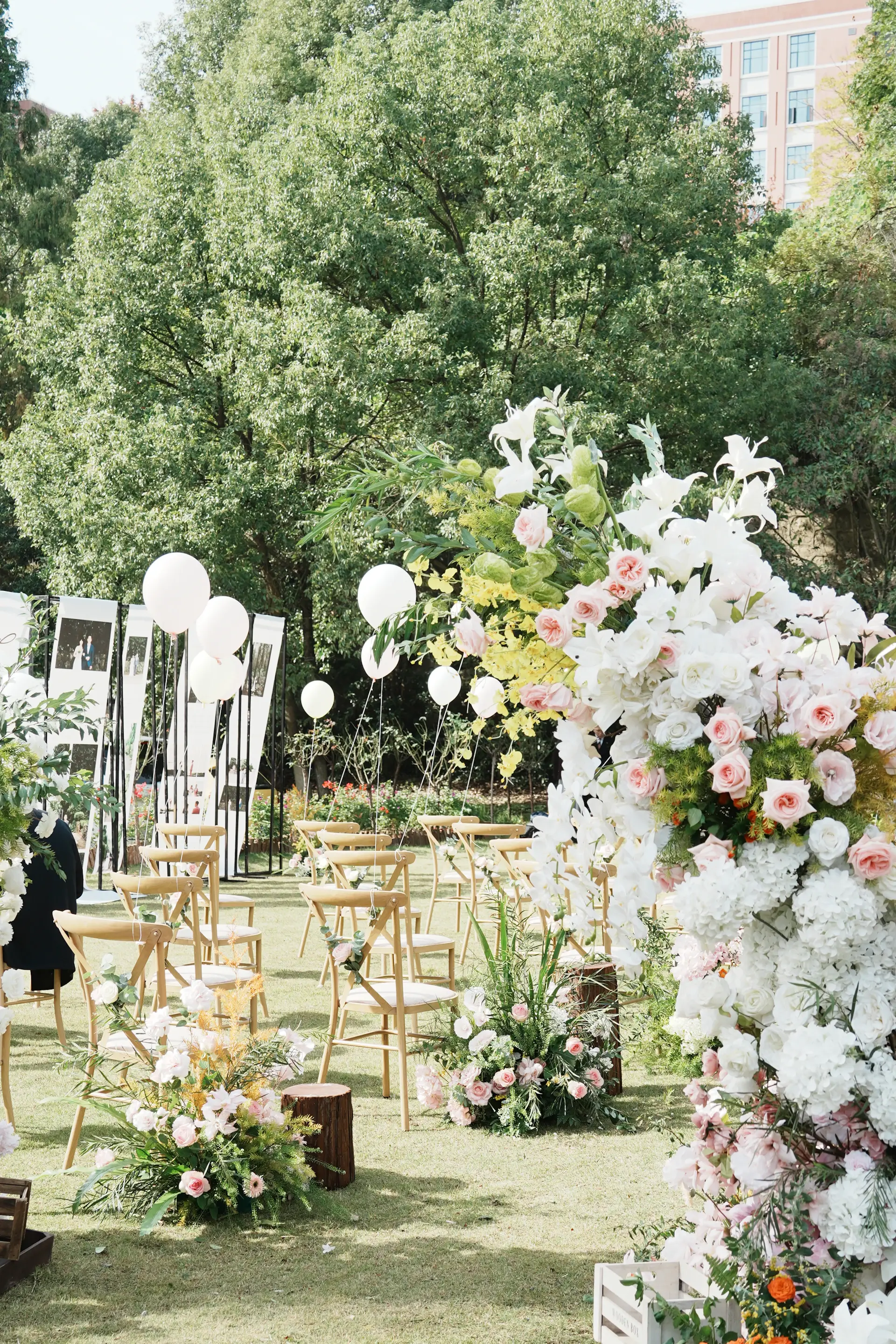 Garden wedding ceremony with ivory florals and soft daylight