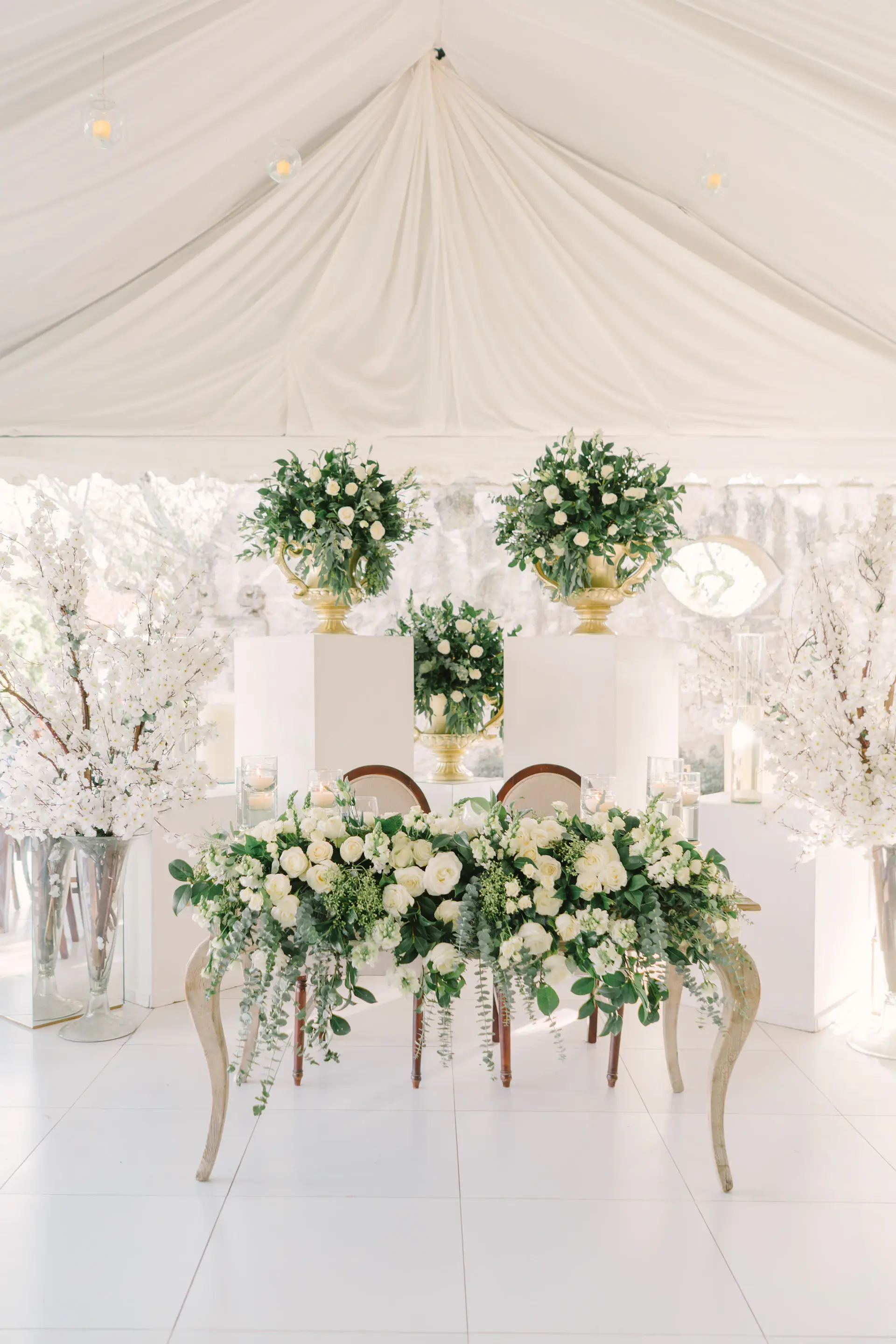An arrangement of white and blush wedding florals