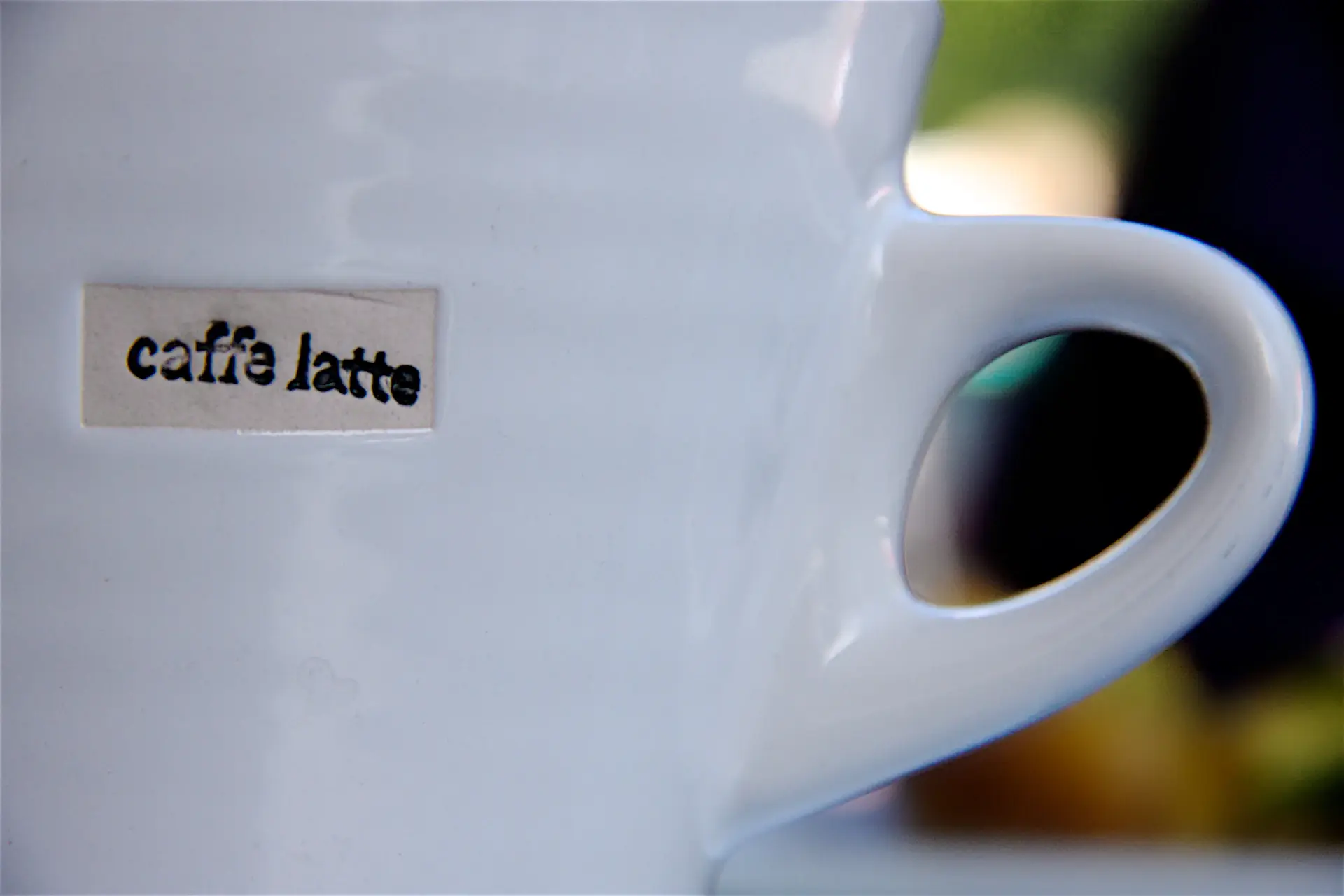 Latte served on porcelain with a tasting card