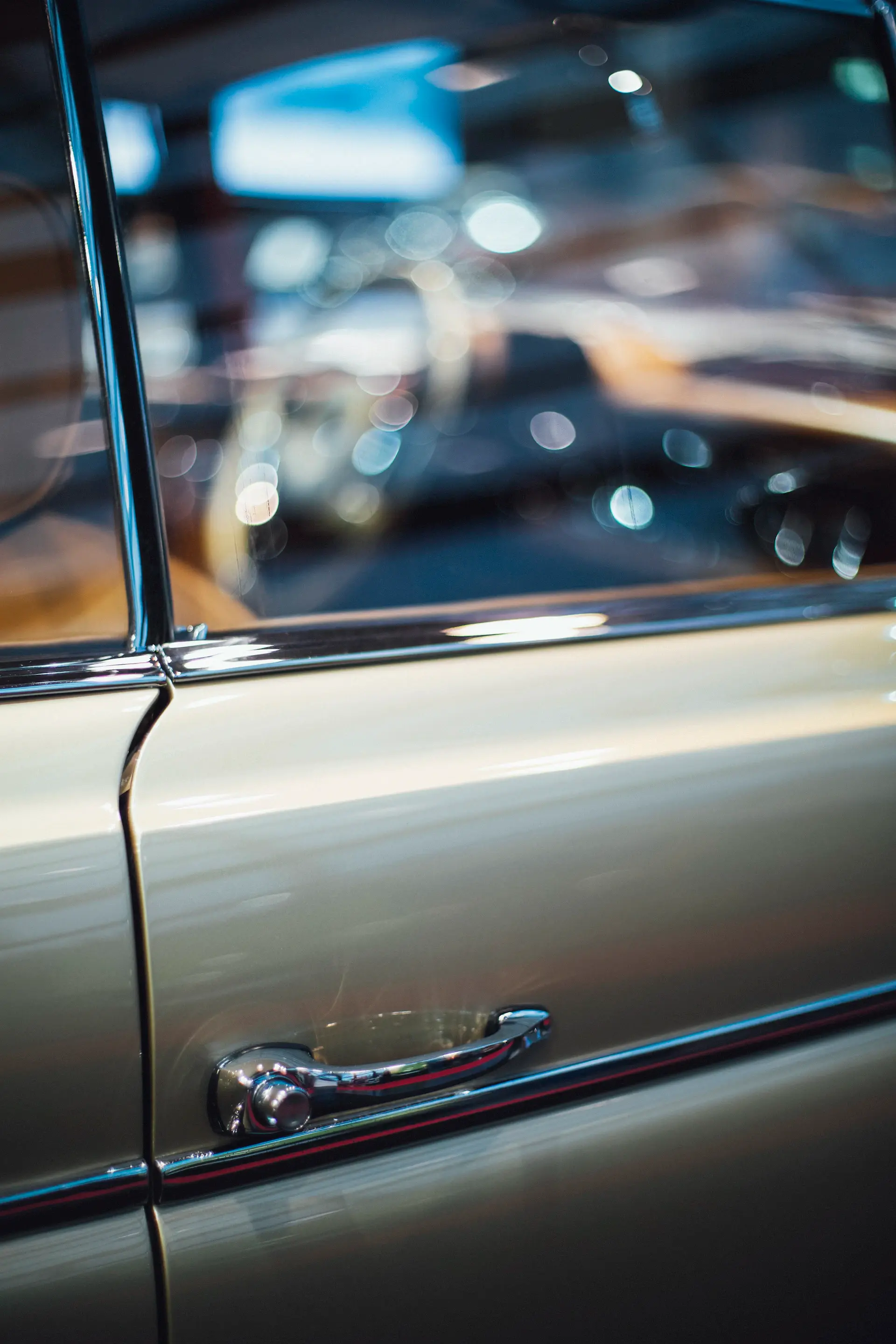 Close-up of champagne gold metallic paint on a car body